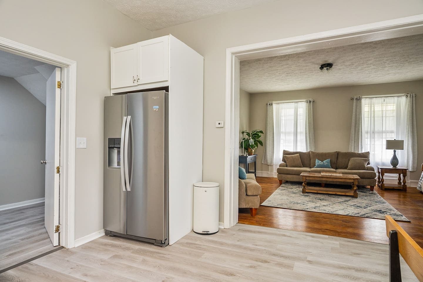 Refrigerator positioned beside the living room