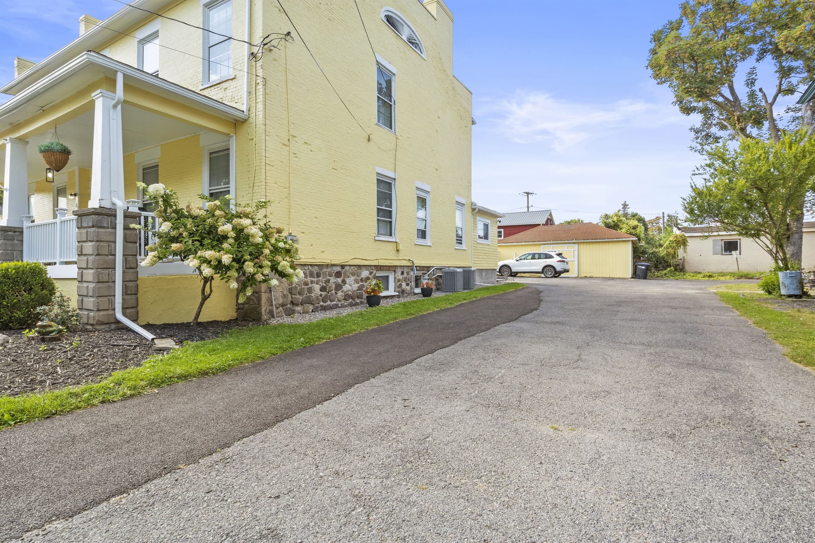 Wide driveway beside the home