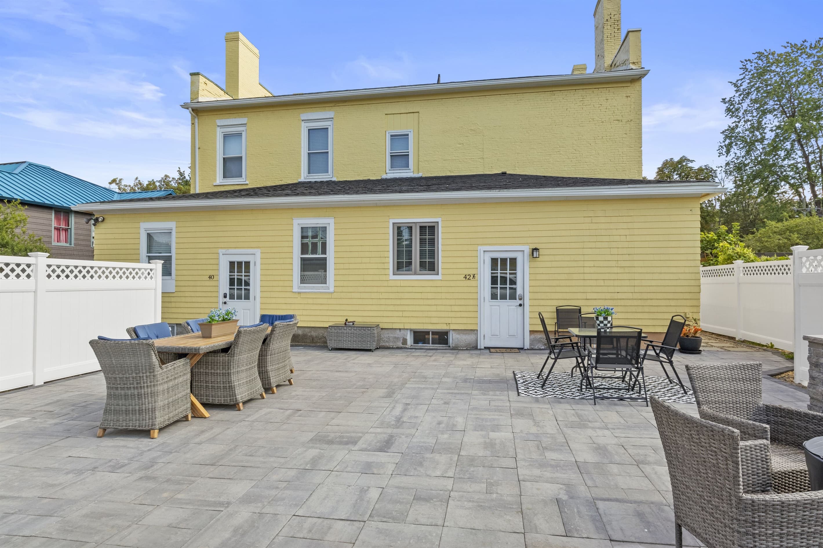 Spacious fenced patio behind the house