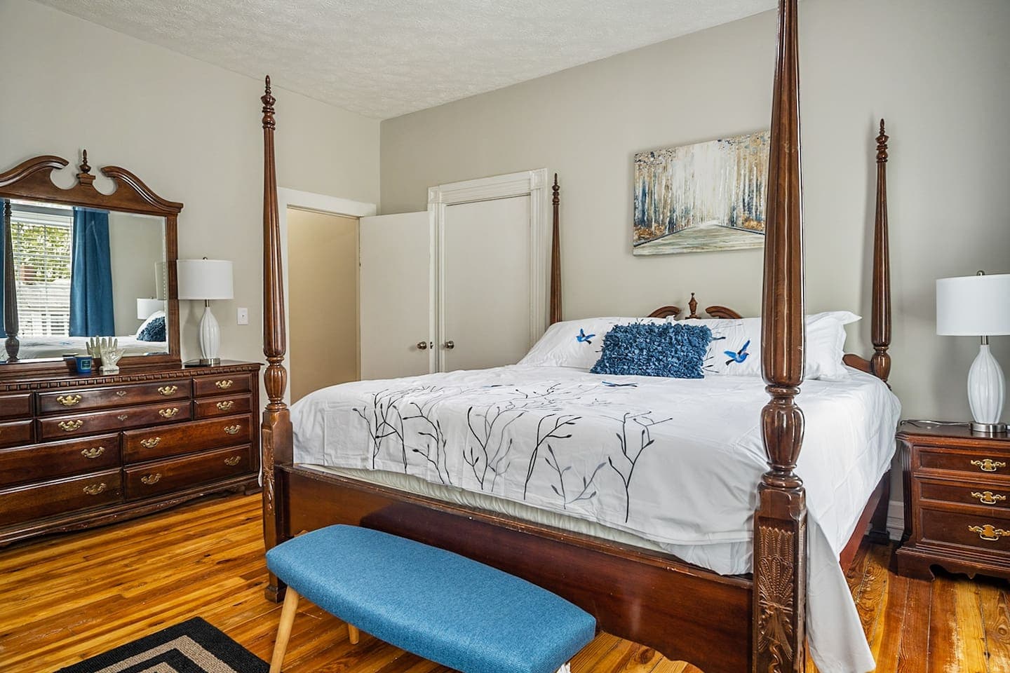 Primary bedroom with four-poster bed