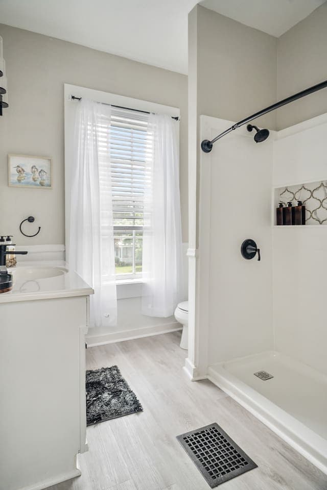 Renovated bathroom with walk-in shower