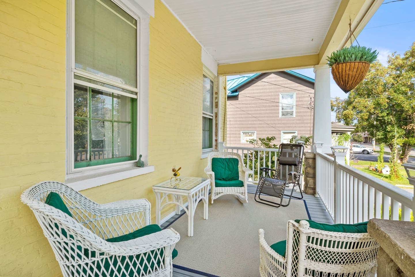 Front porch with chairs and bench seating