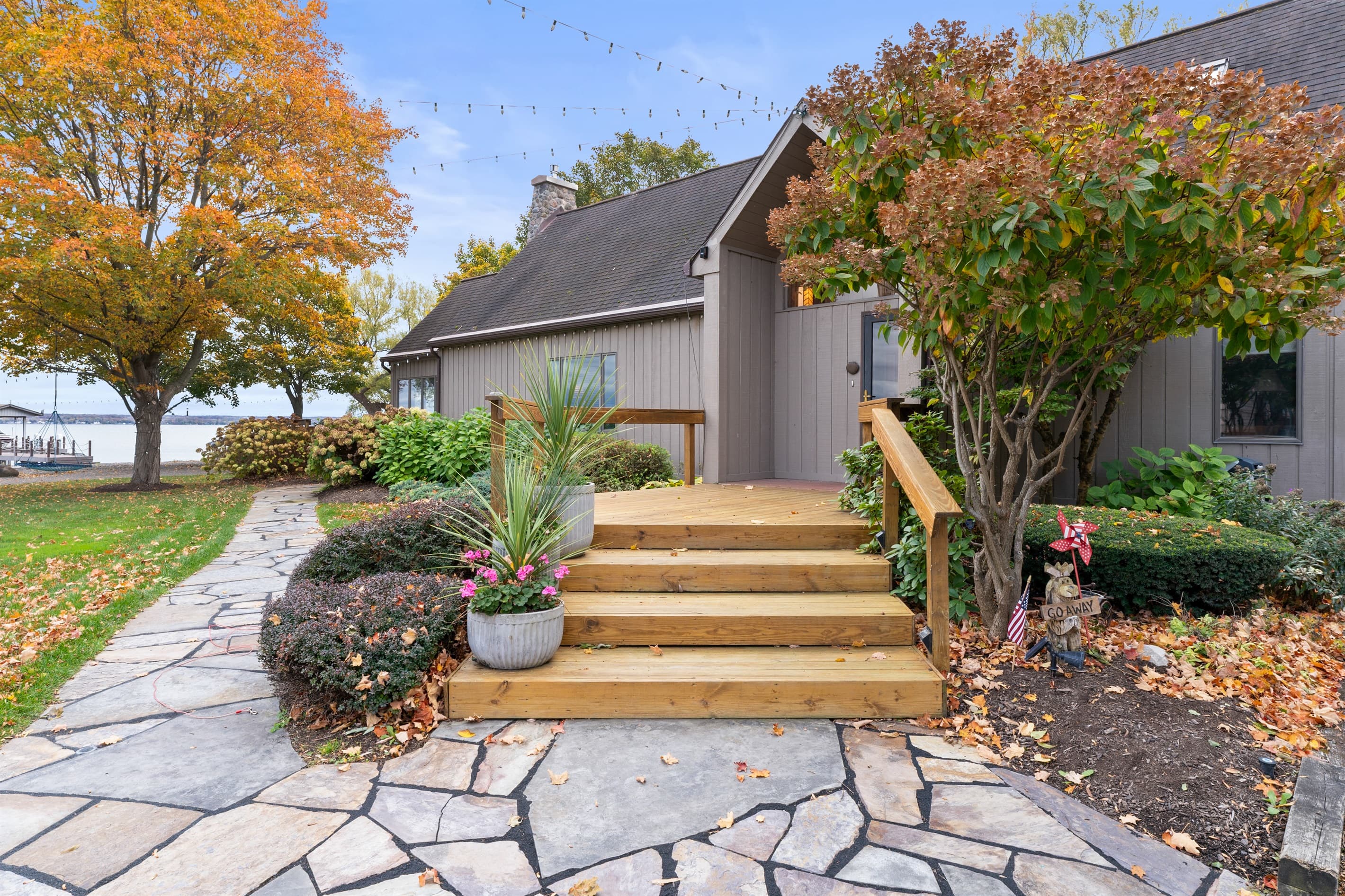 Landscaped entrance with wooden steps