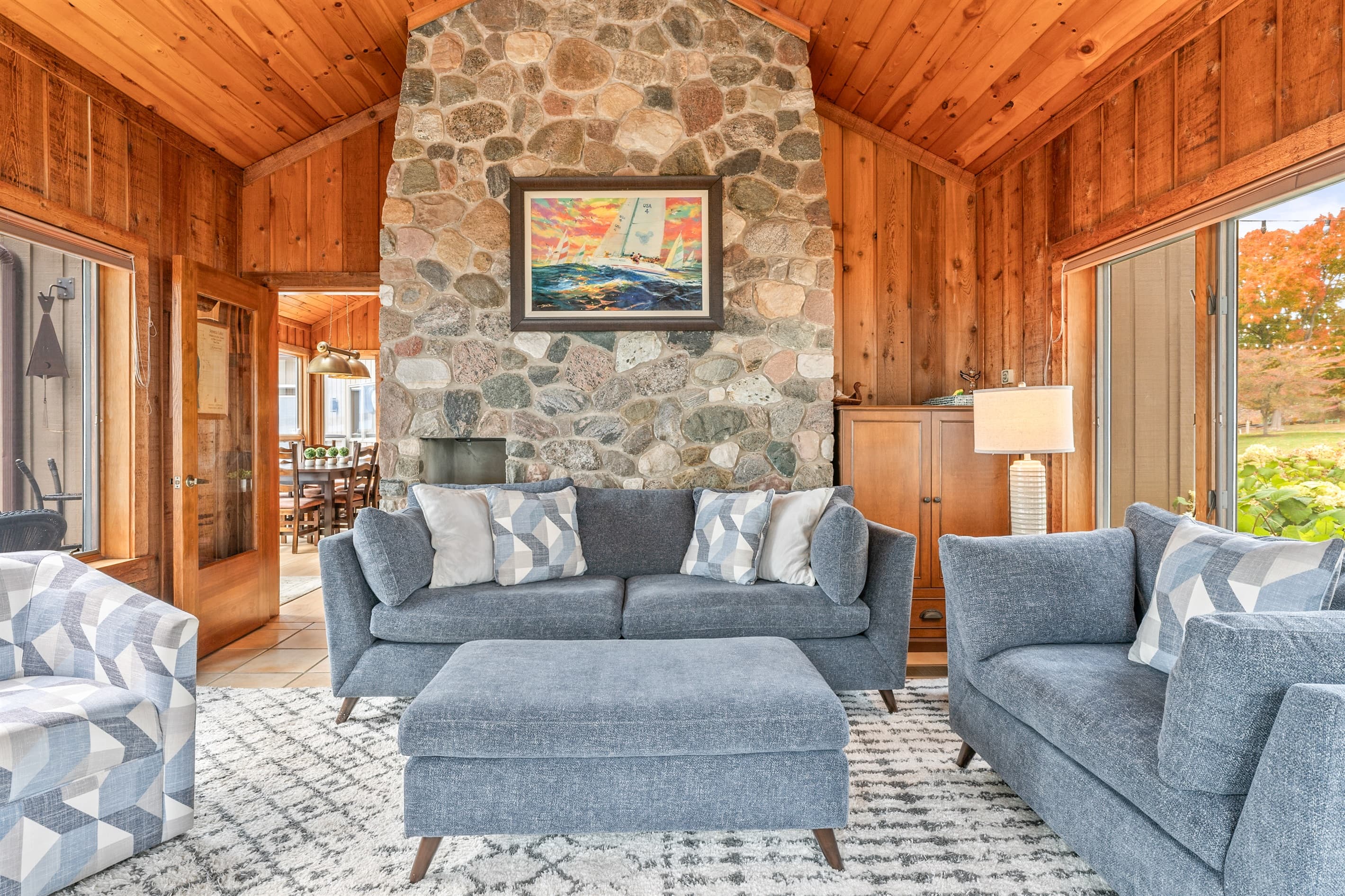 Seating area centered around the stone fireplace