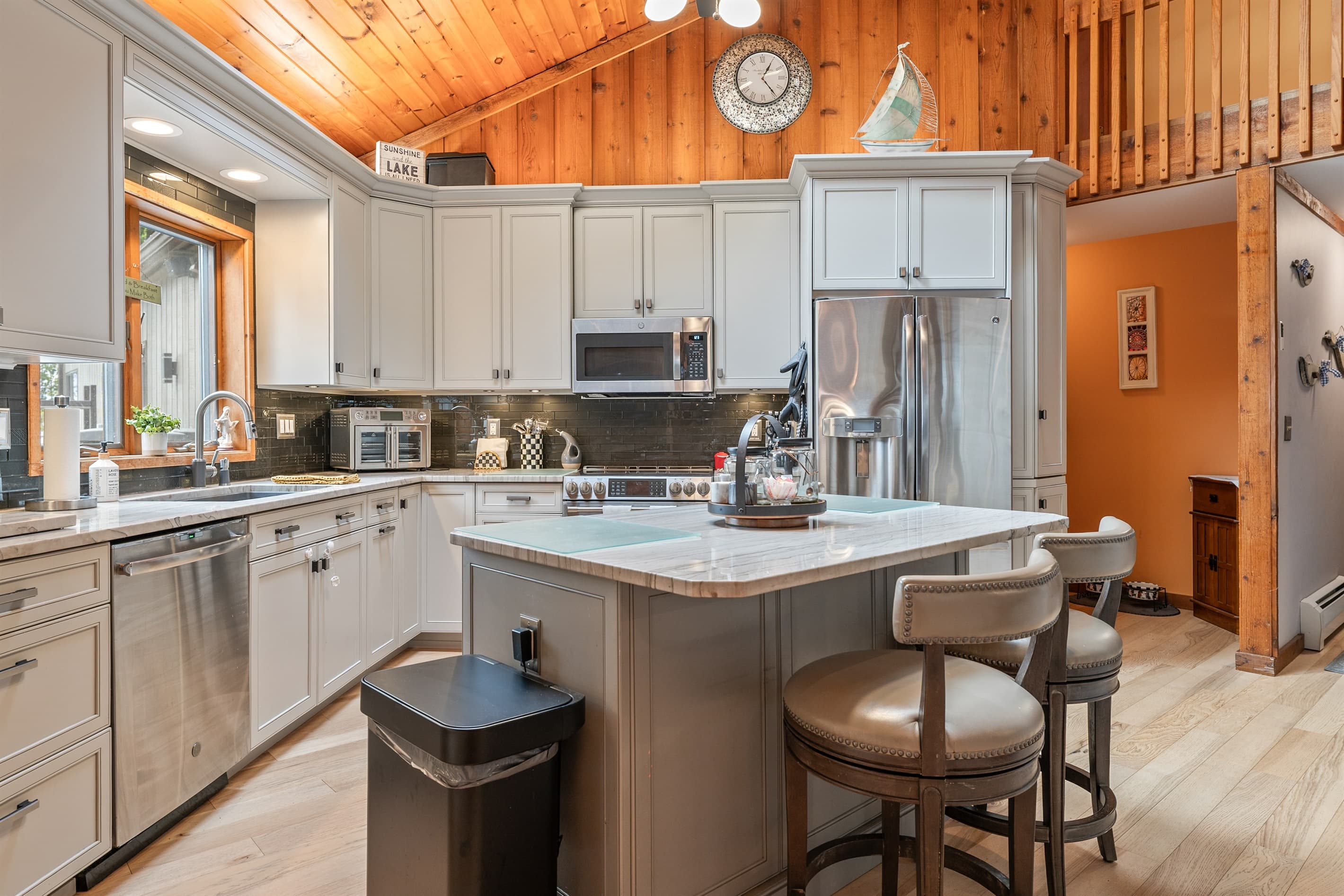 Kitchen with breakfast bar and ample cabinetry