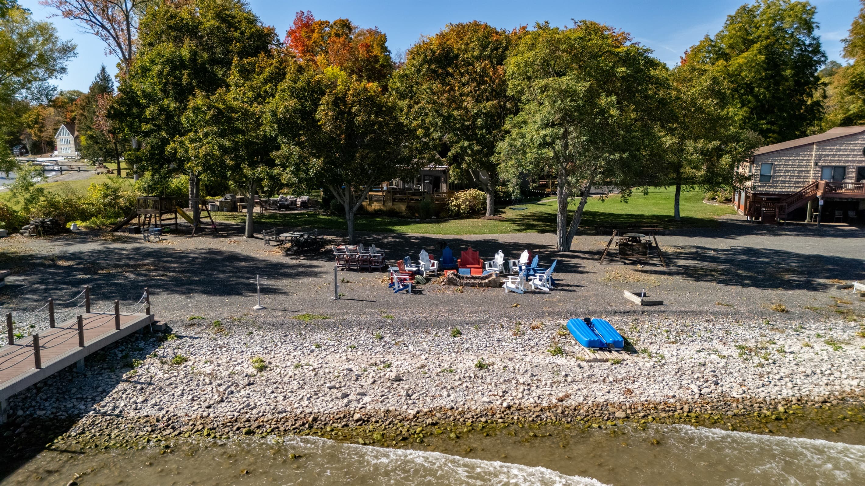 Private shoreline with seating and kayaks