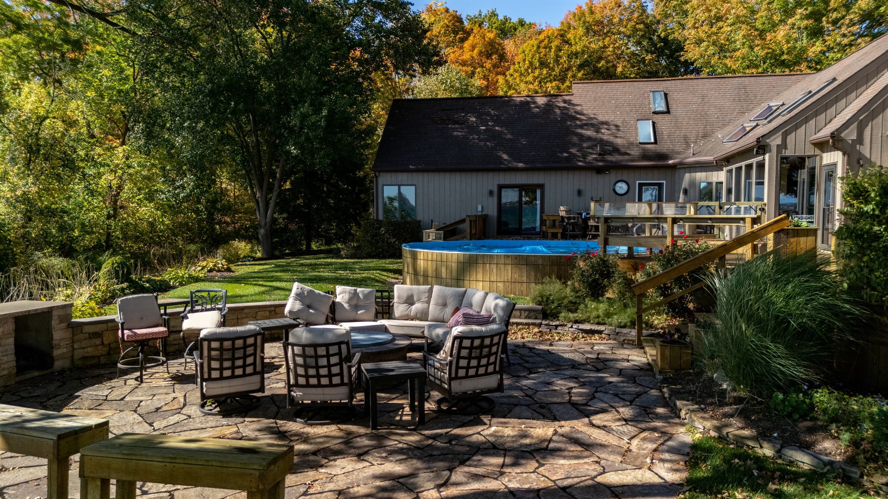 Stone patio with fire pit and dining area