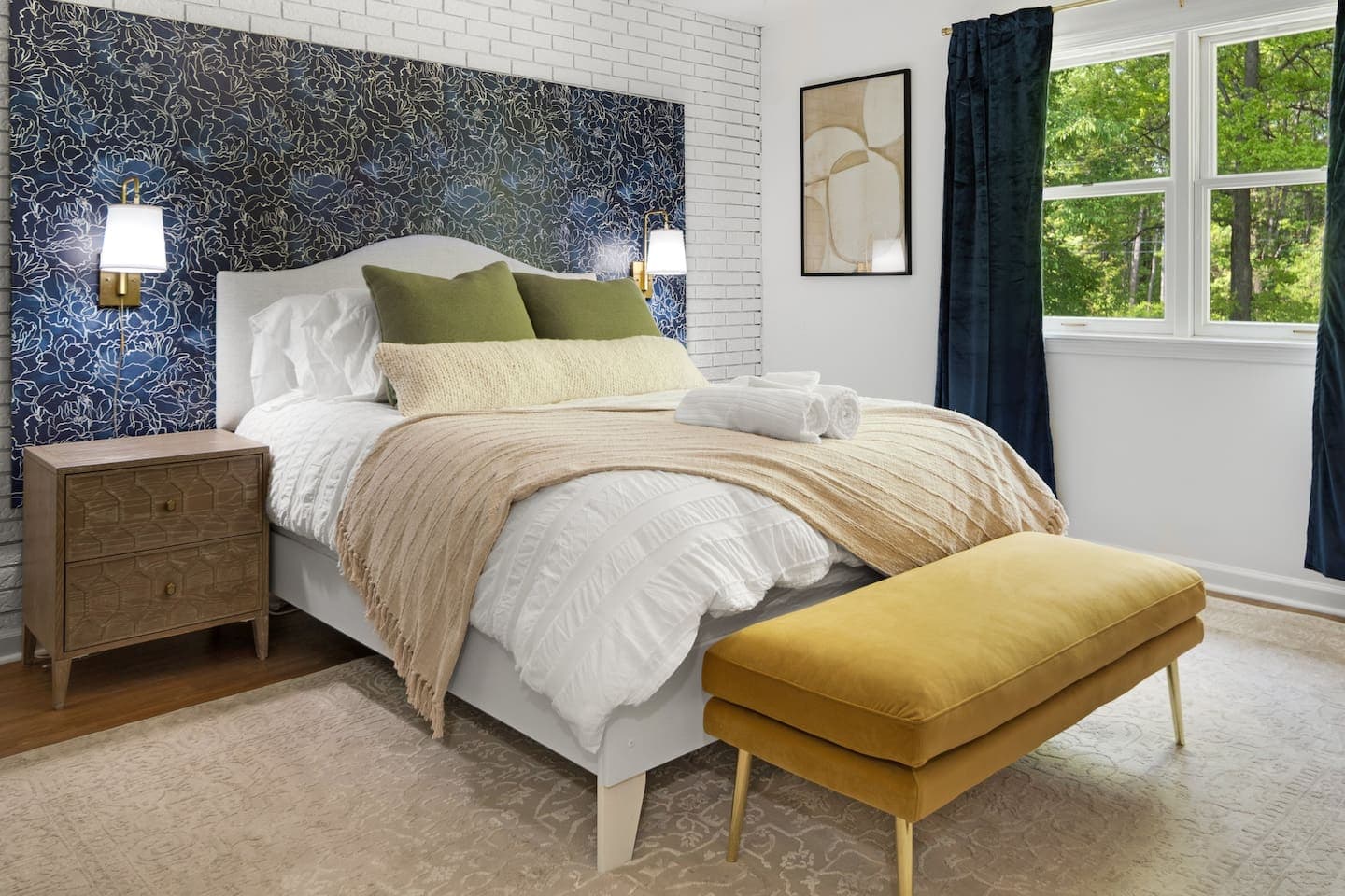 Bedroom with dark blue accent wall