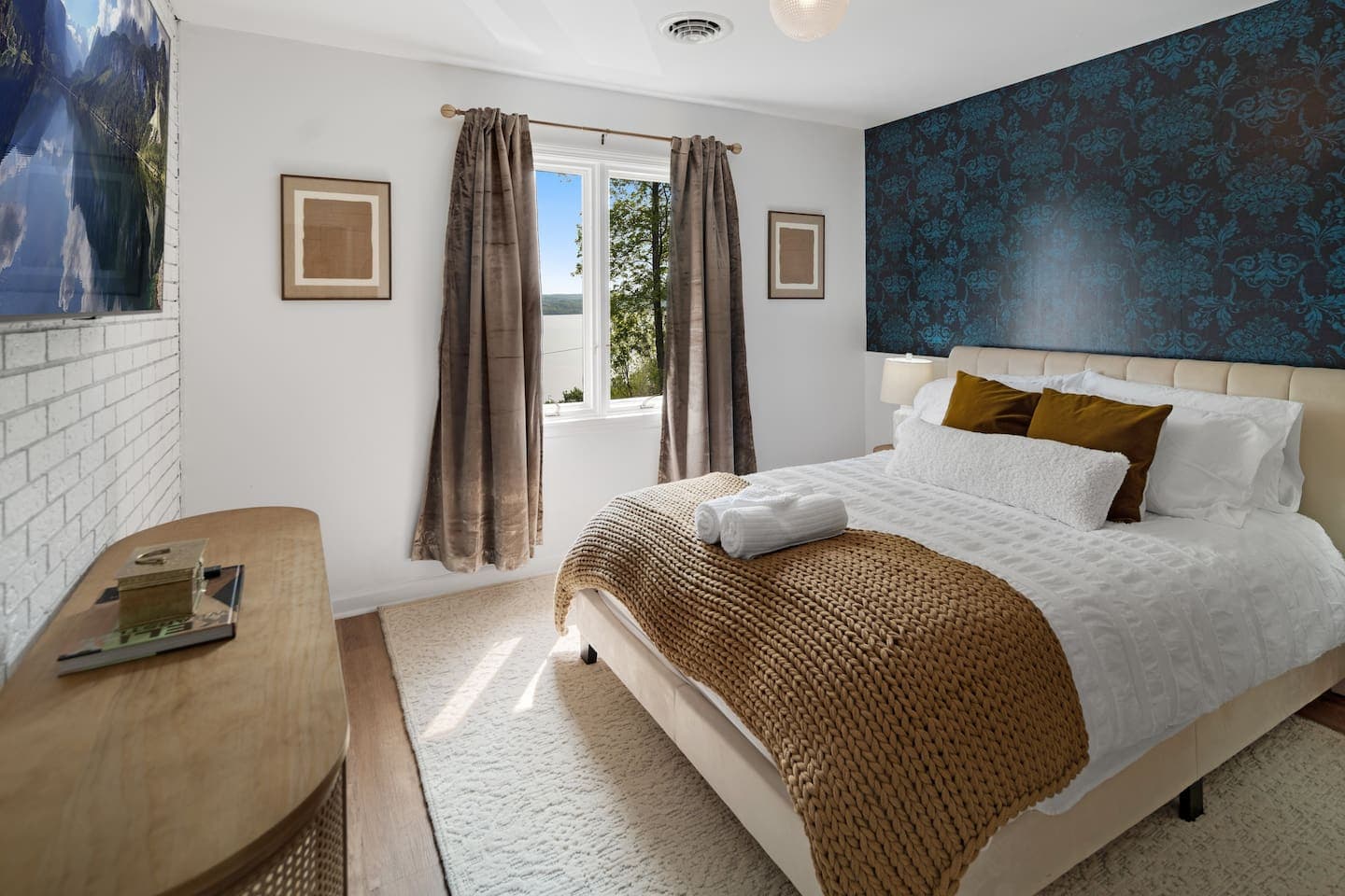 Bedroom with queen bed and vintage accent wall