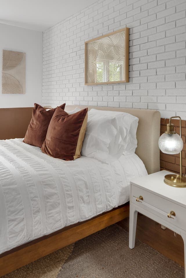 Bedside table with a golden lamp 