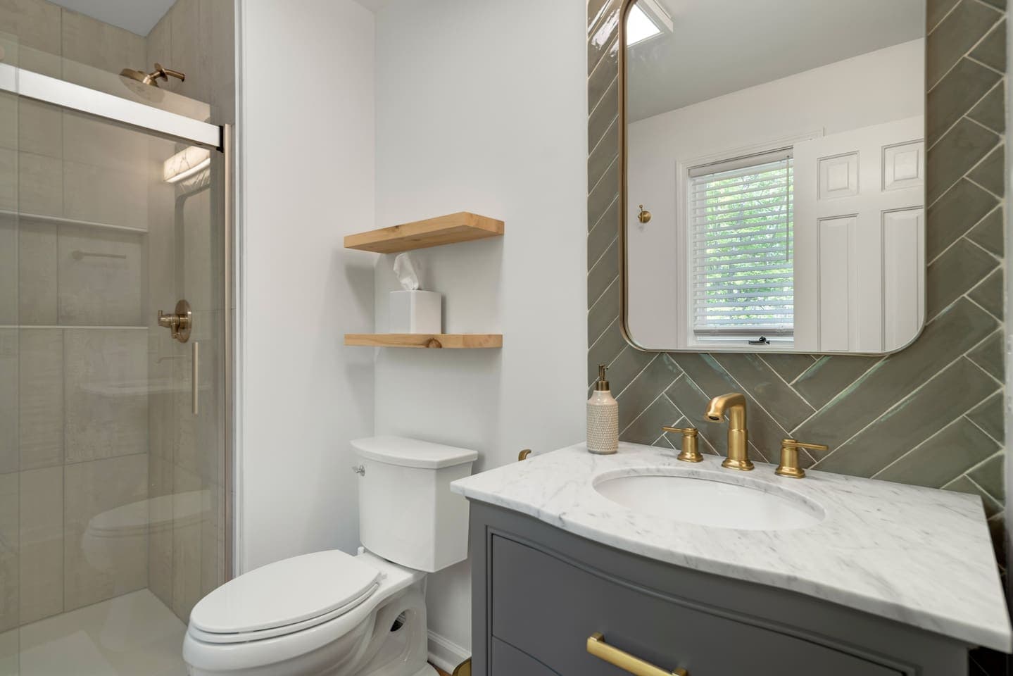 Bathroom with glass shower and vanity