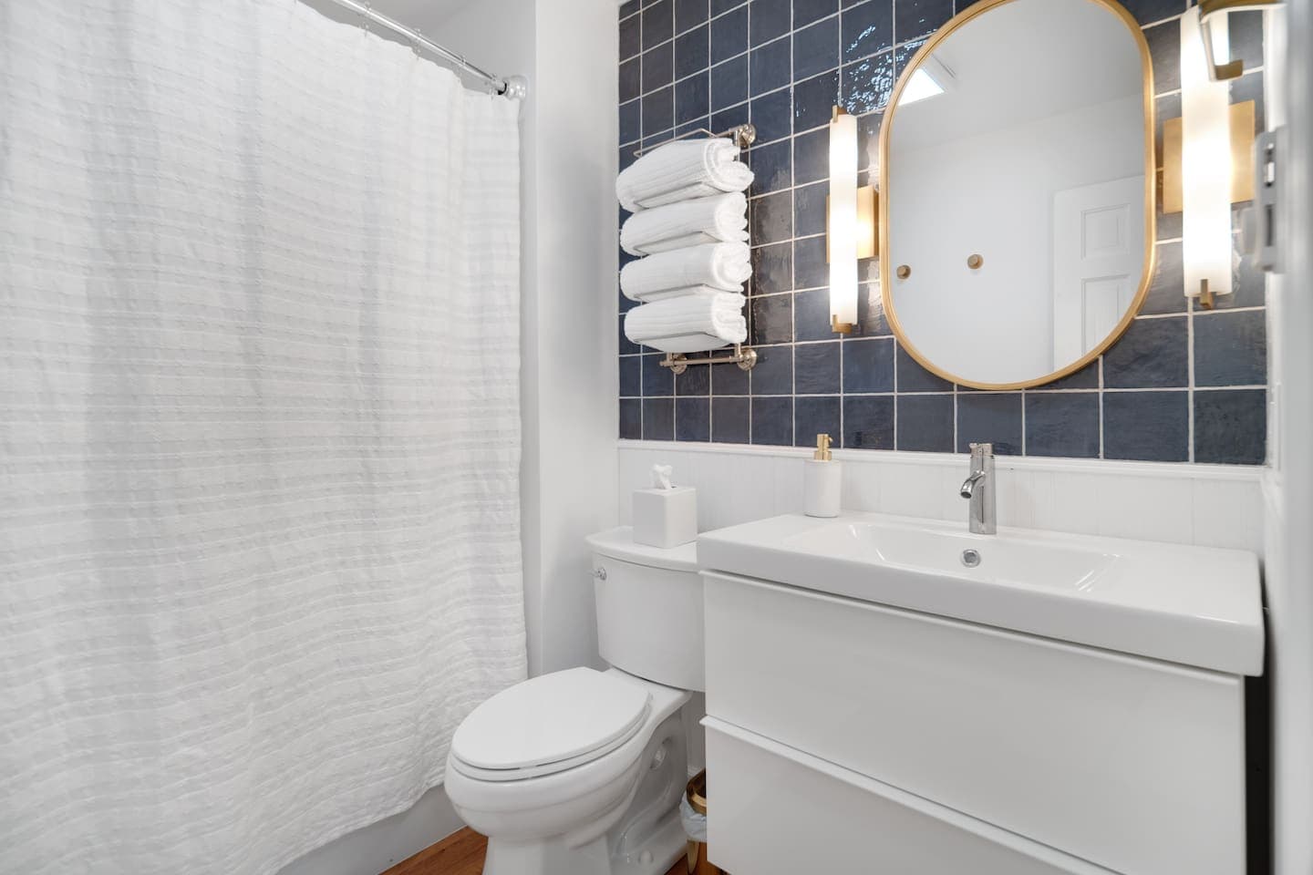 Bathroom vanity with round mirror