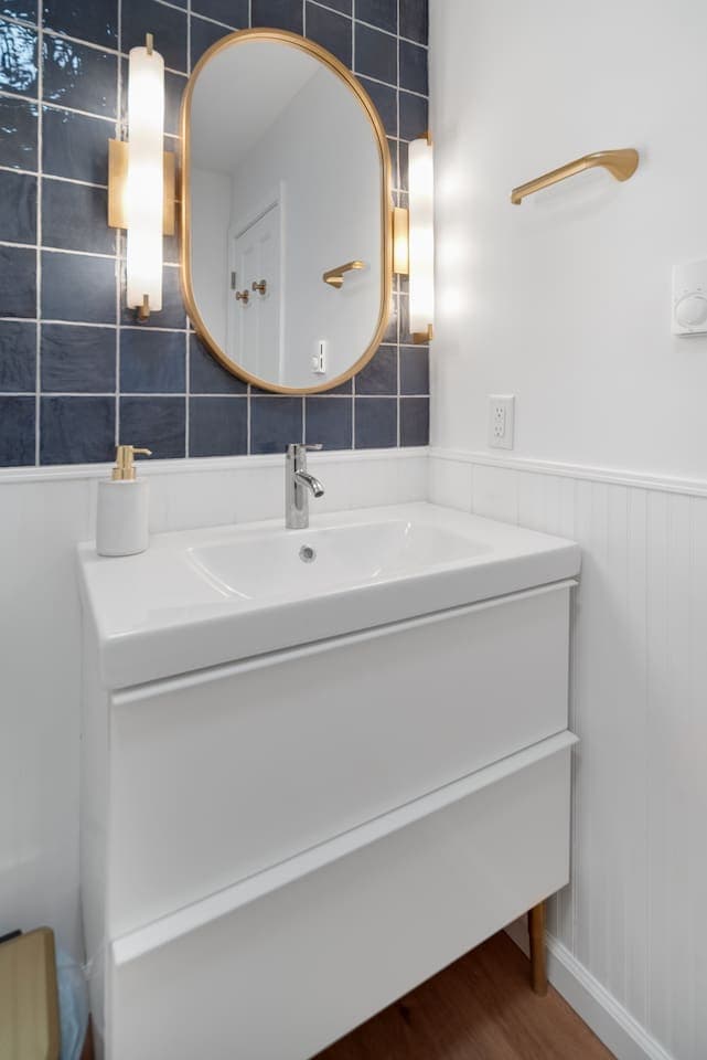 Bathroom vanity with gold decor