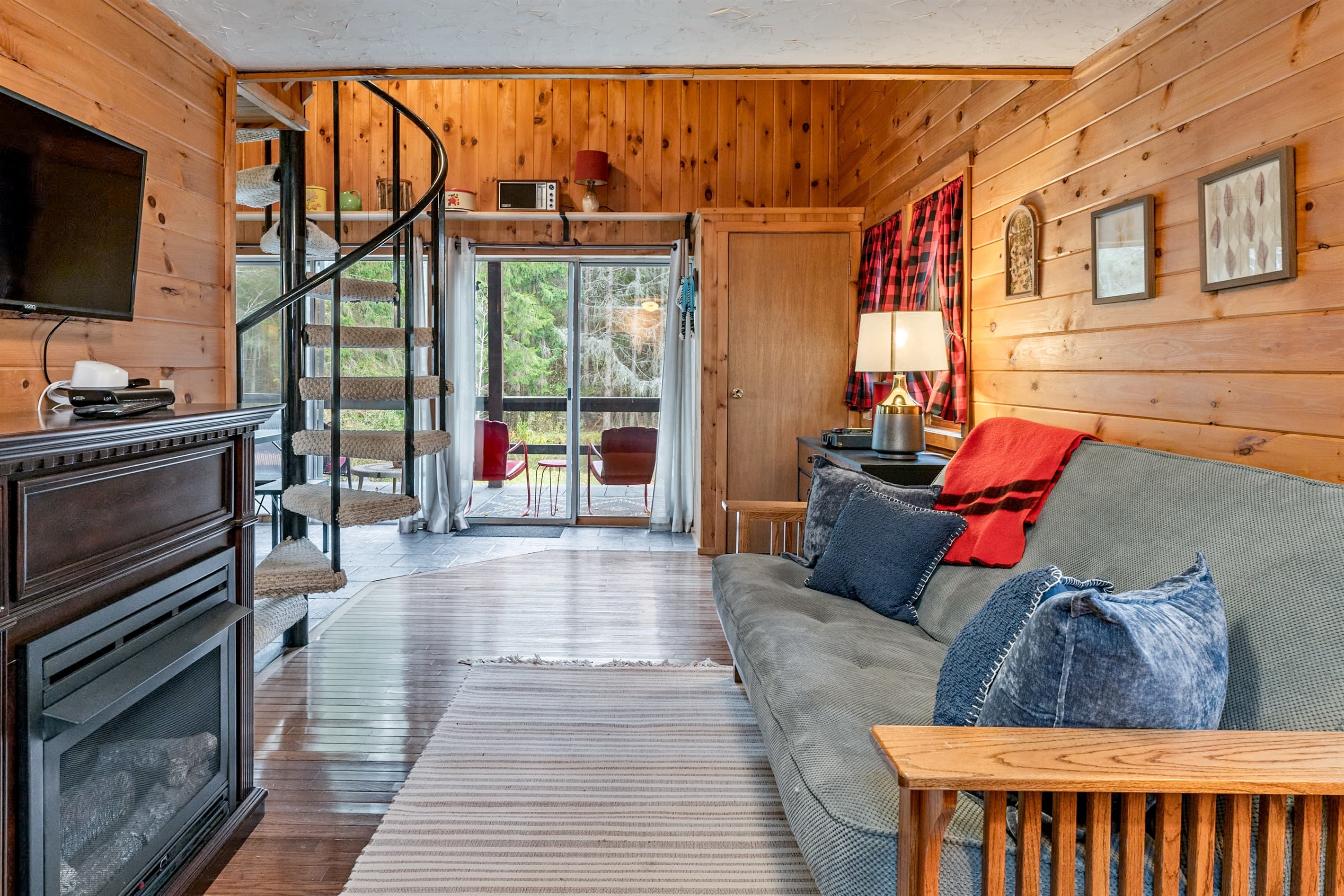 Living room with wood-paneled walls