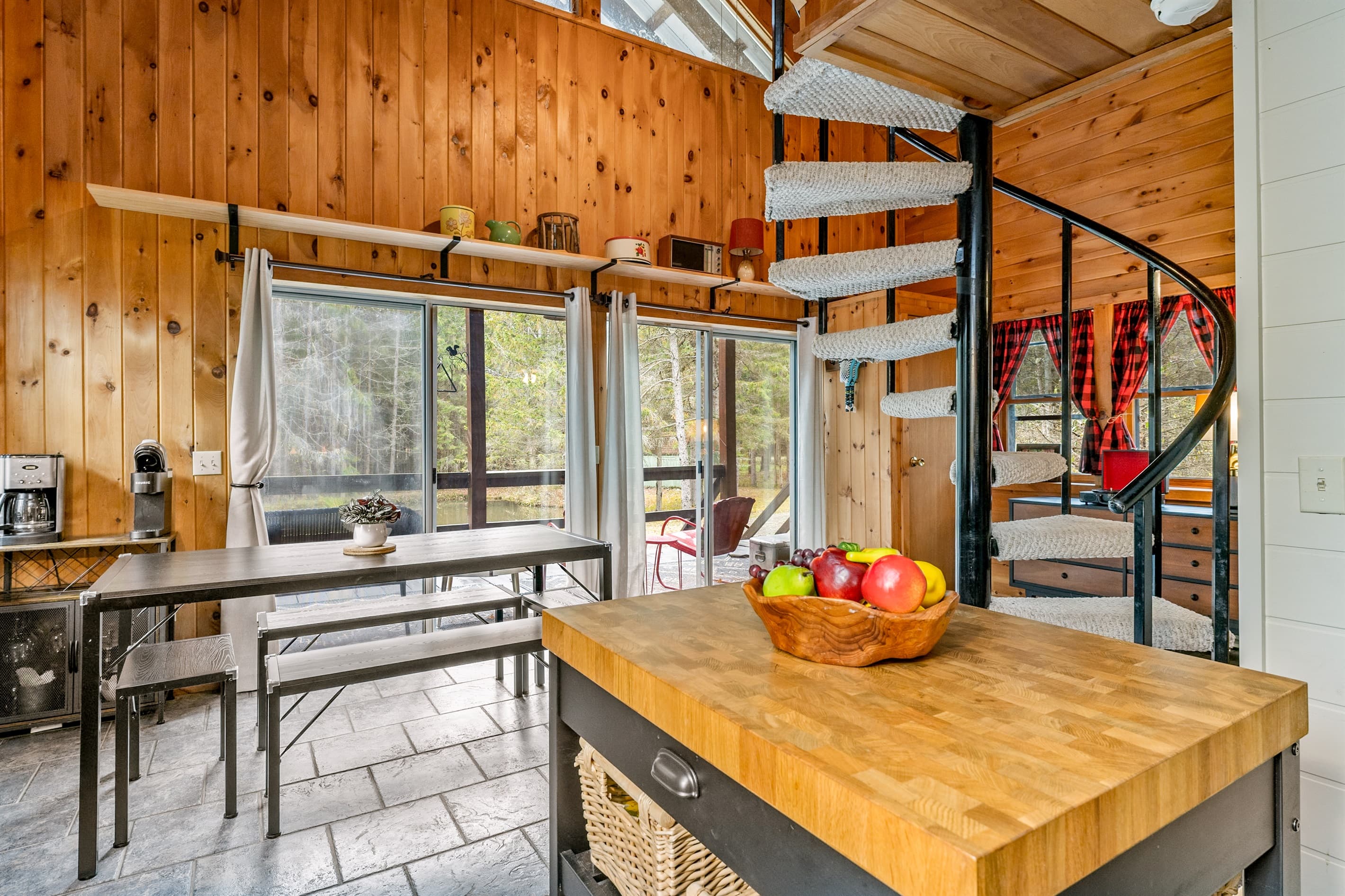 Wooden dining table beside sliding glass doors