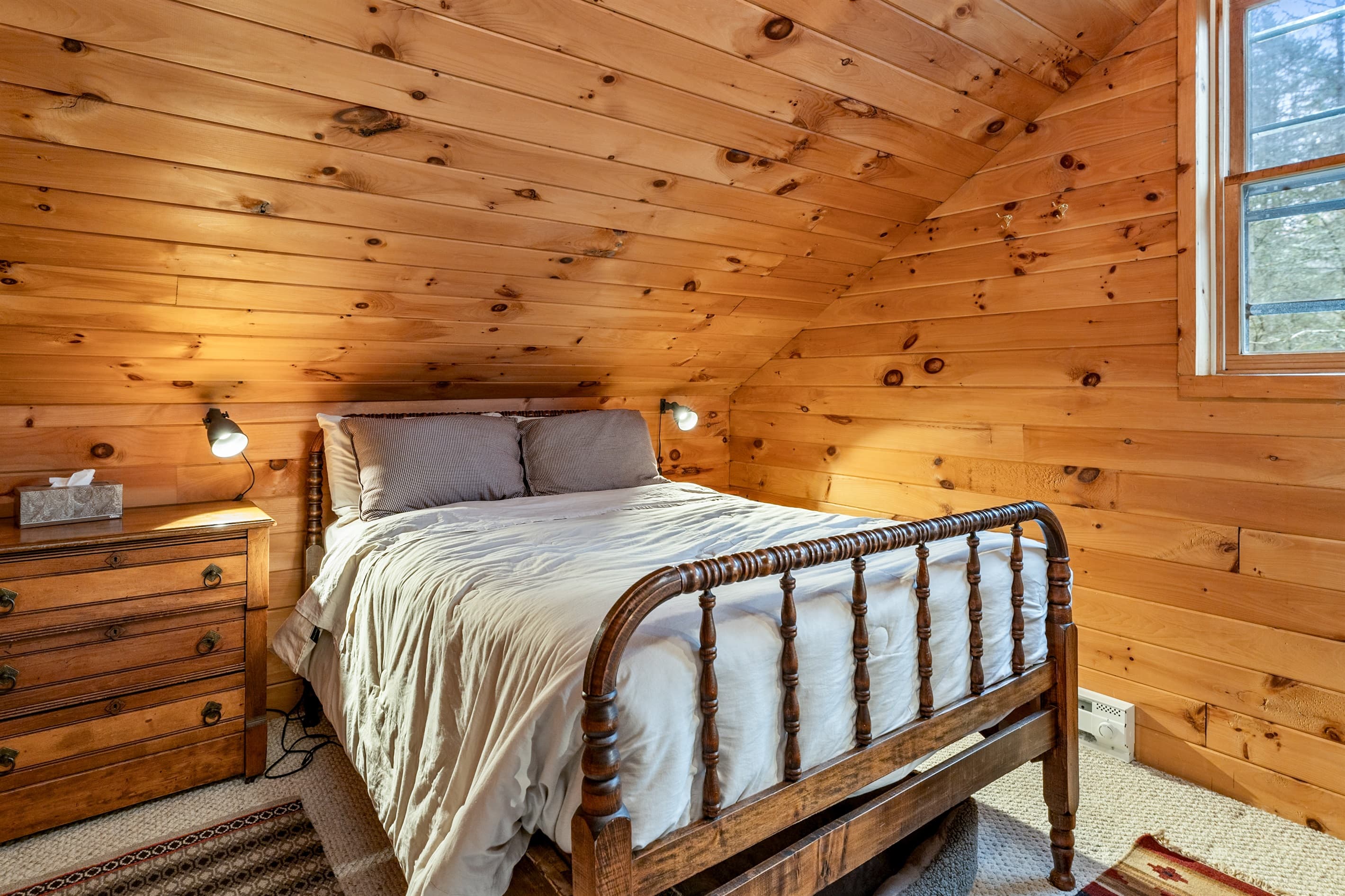 Bedroom with wooden framed bed