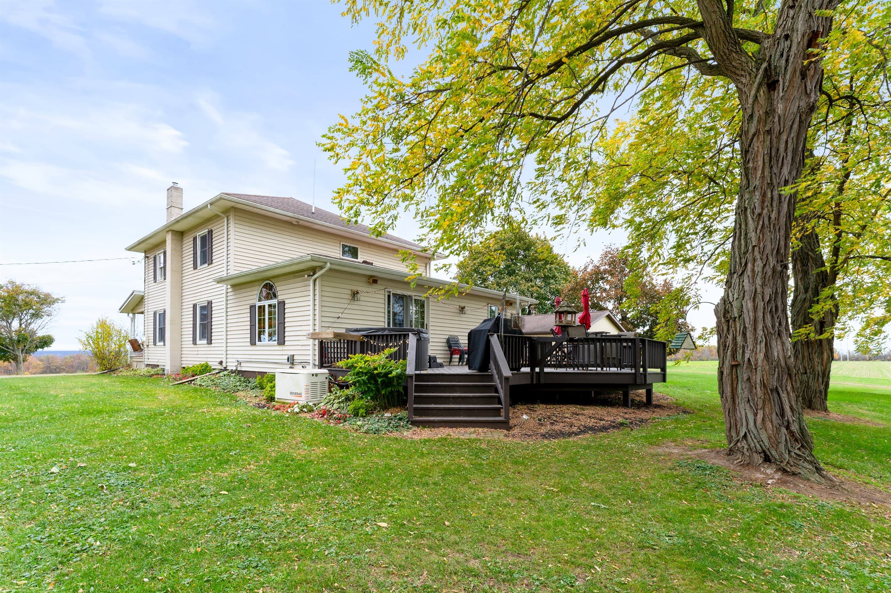 Side deck beneath a large shade tree