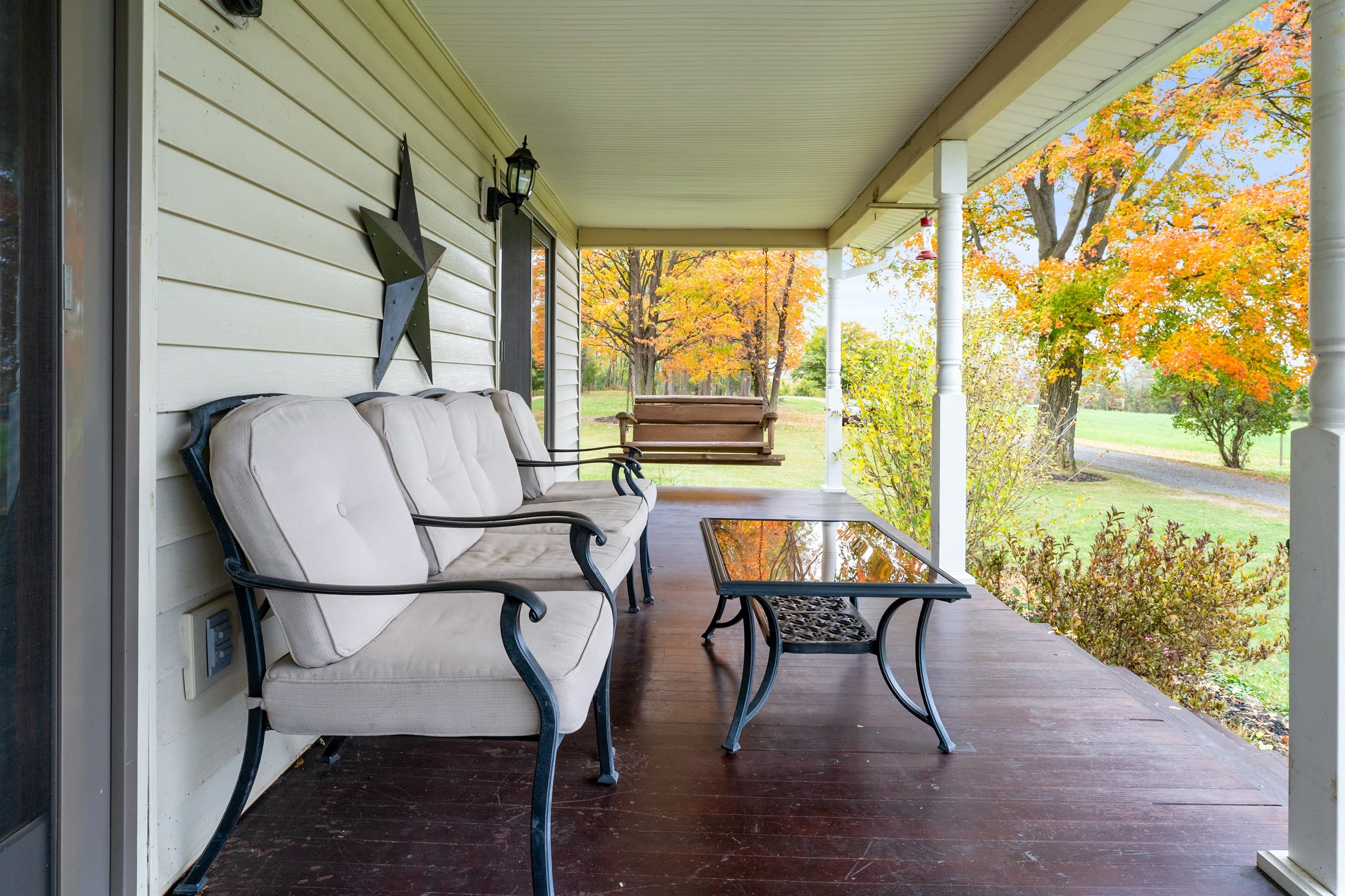 Covered porch with cushioned seating
