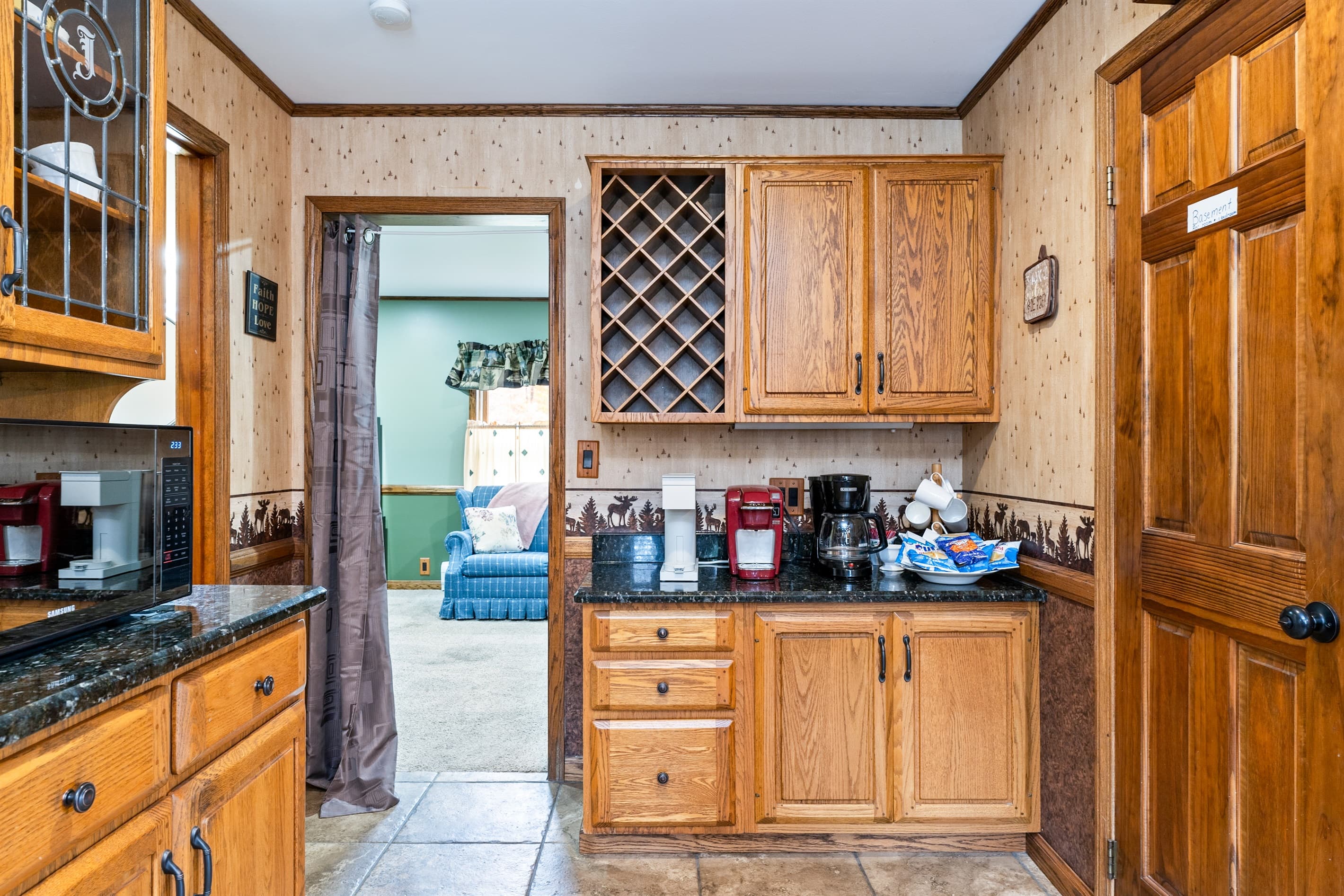 Kitchen with oak cabinetry and built-in storage