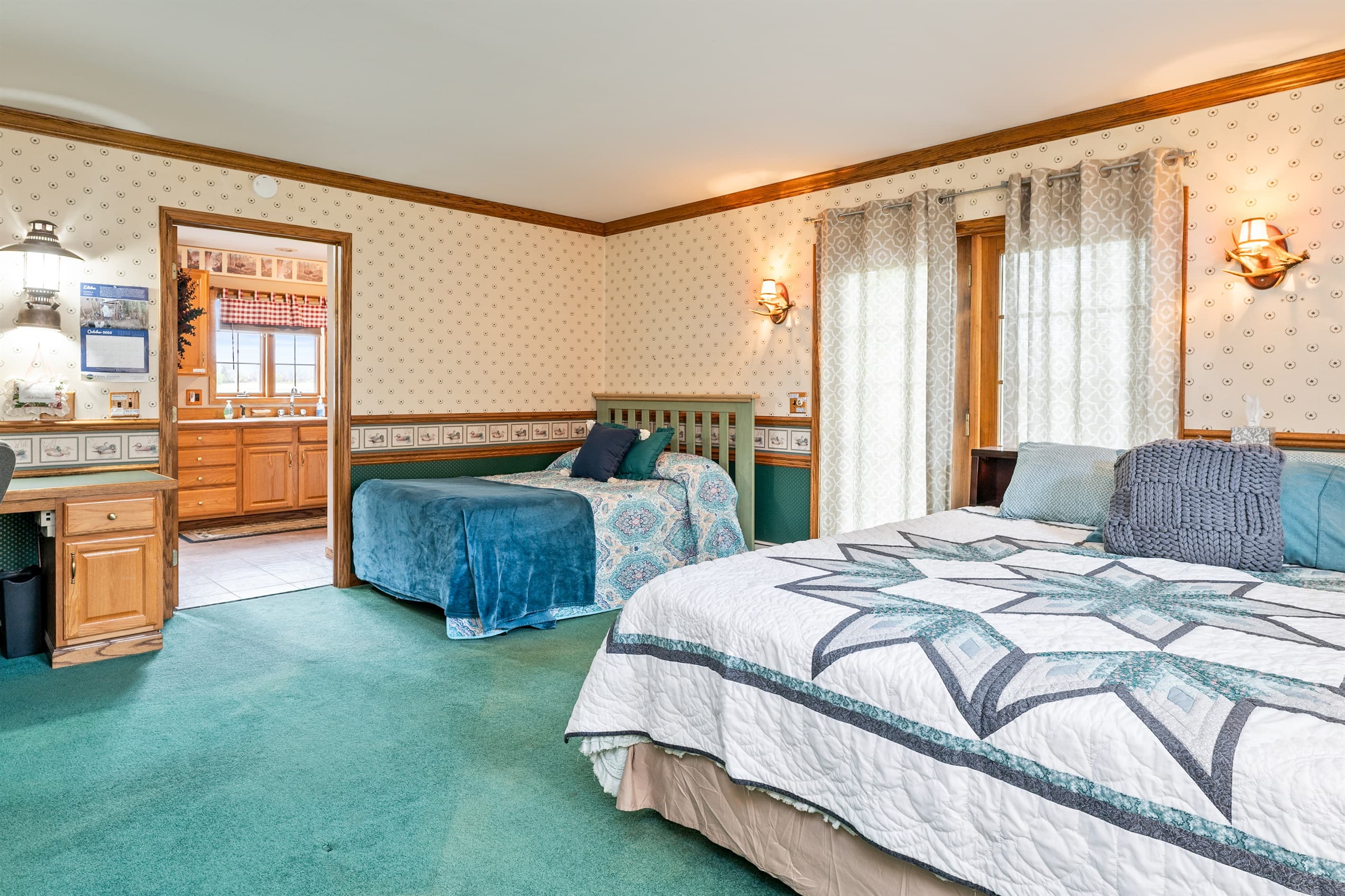 Main-floor king bedroom with additional bed