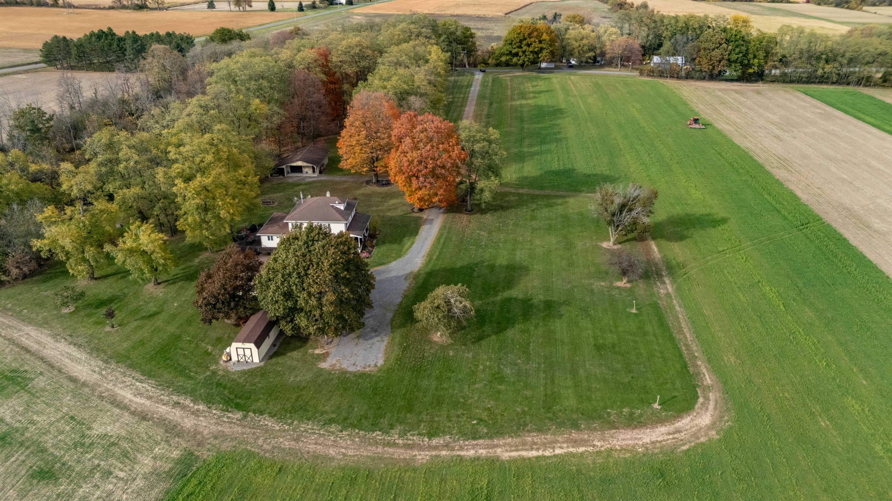 Aerial view of the farmhouse and driveway