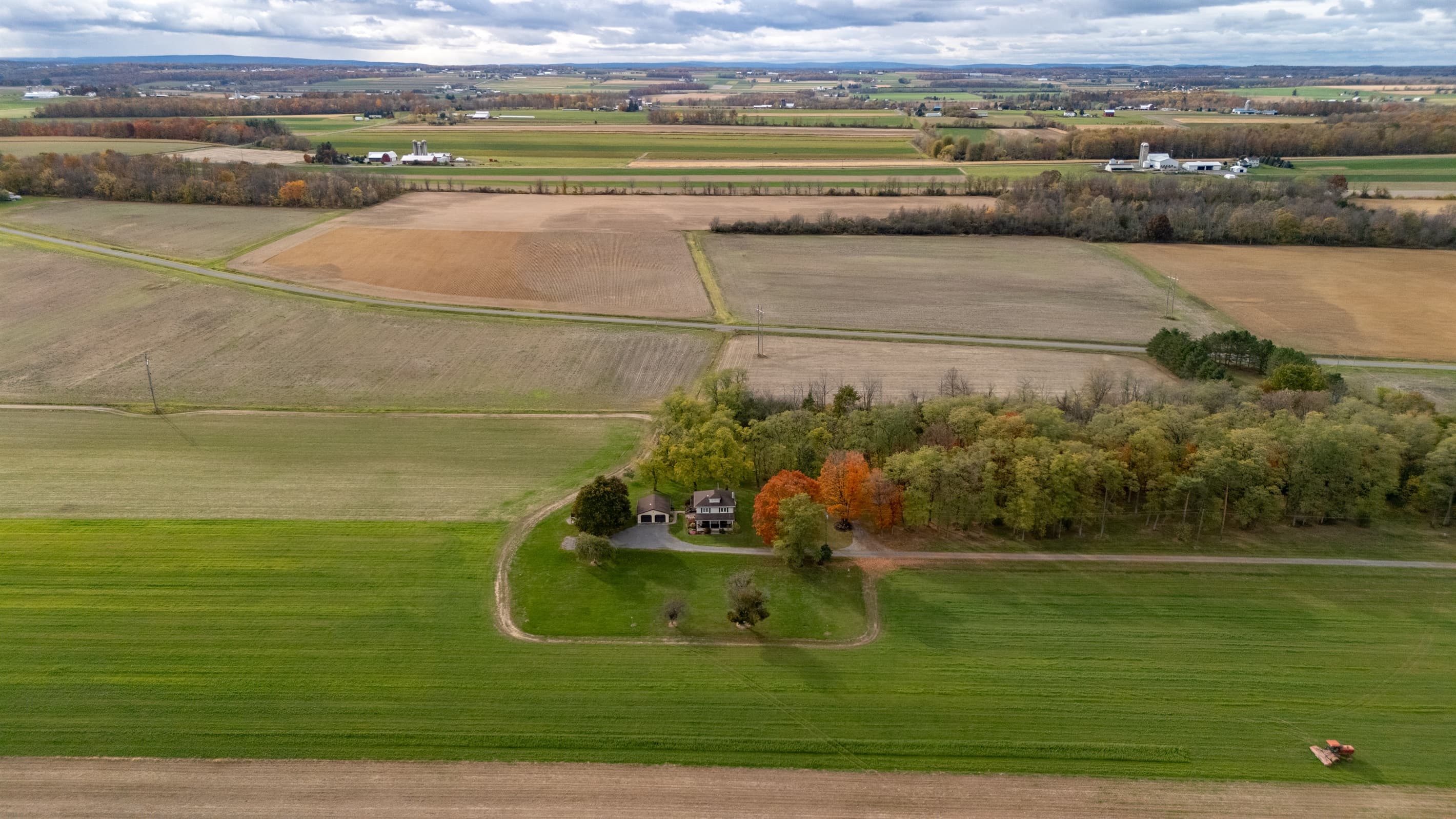 Expansive farmland stretching toward the horizon