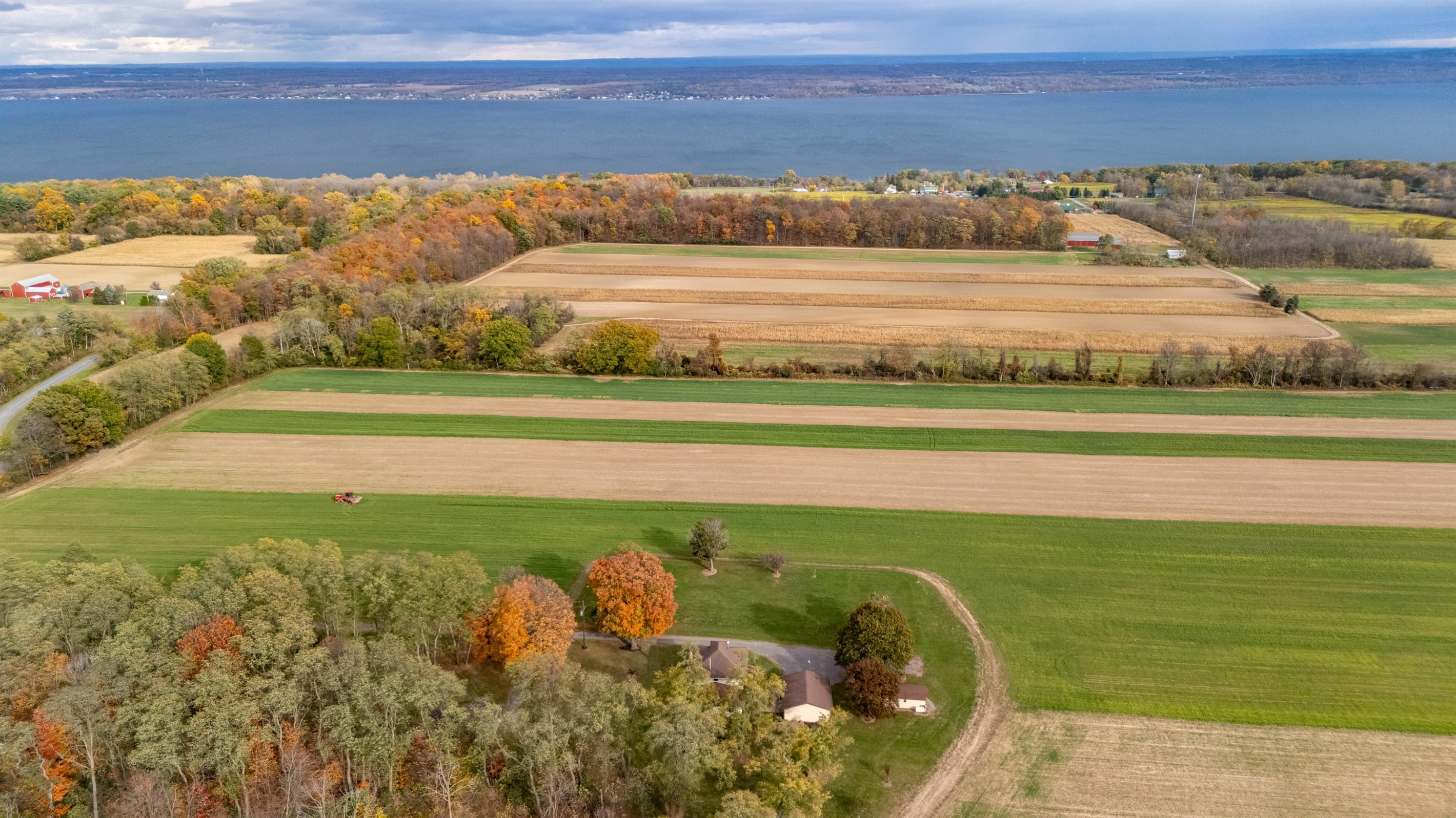 Aerial view of fields and distant lake