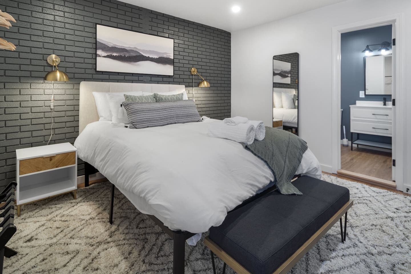 Bedroom with brick accent wall