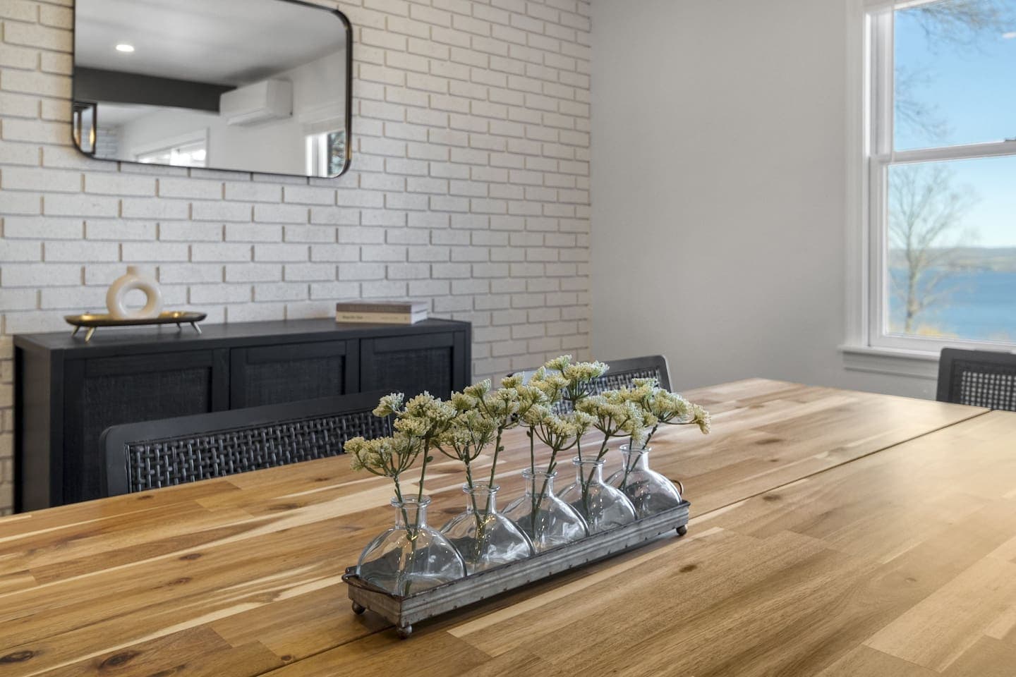 Dining area beside dining console with decor