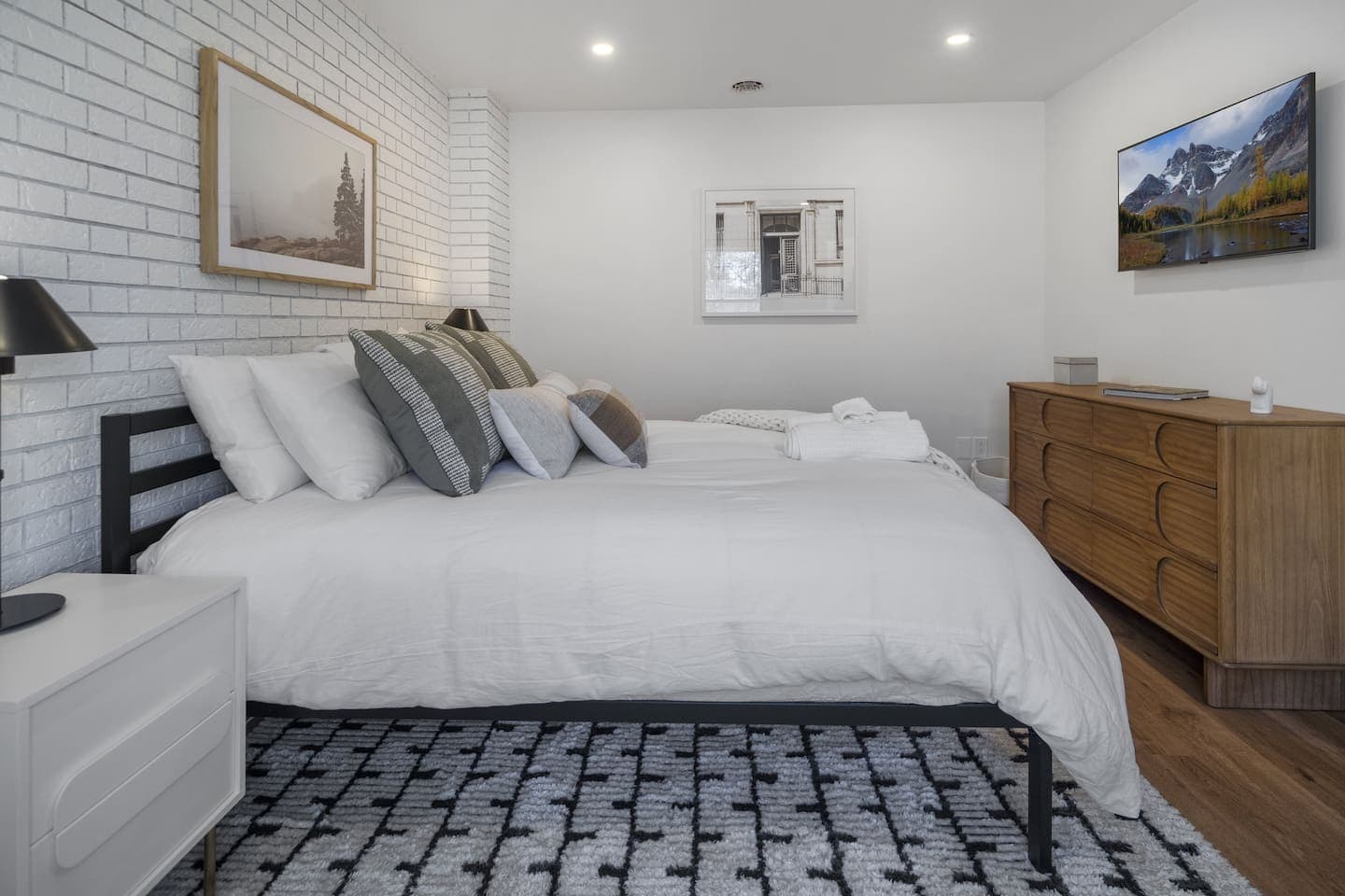 Bedroom with dresser and natural light