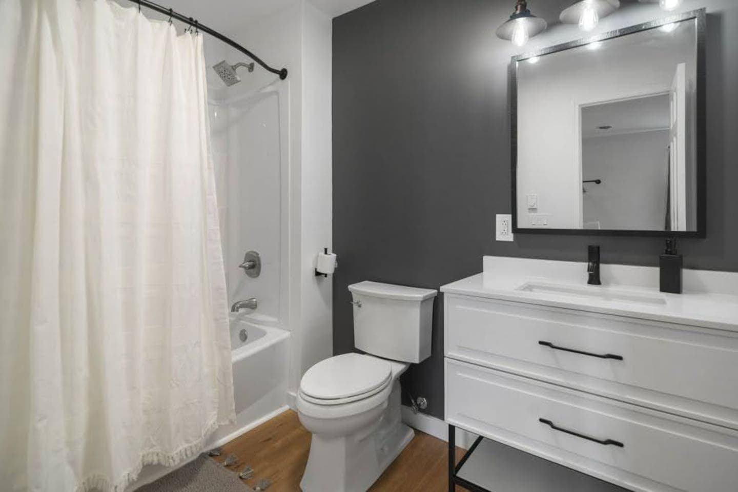 Bathroom with tub and vanity