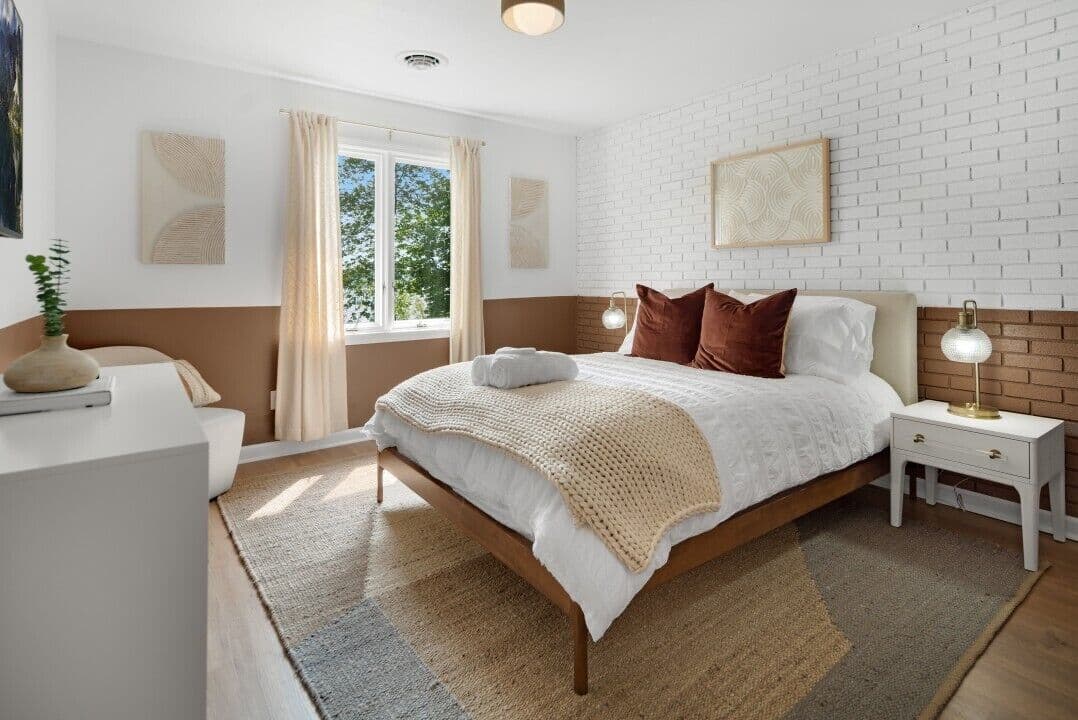 Bright bedroom with brick accent wall