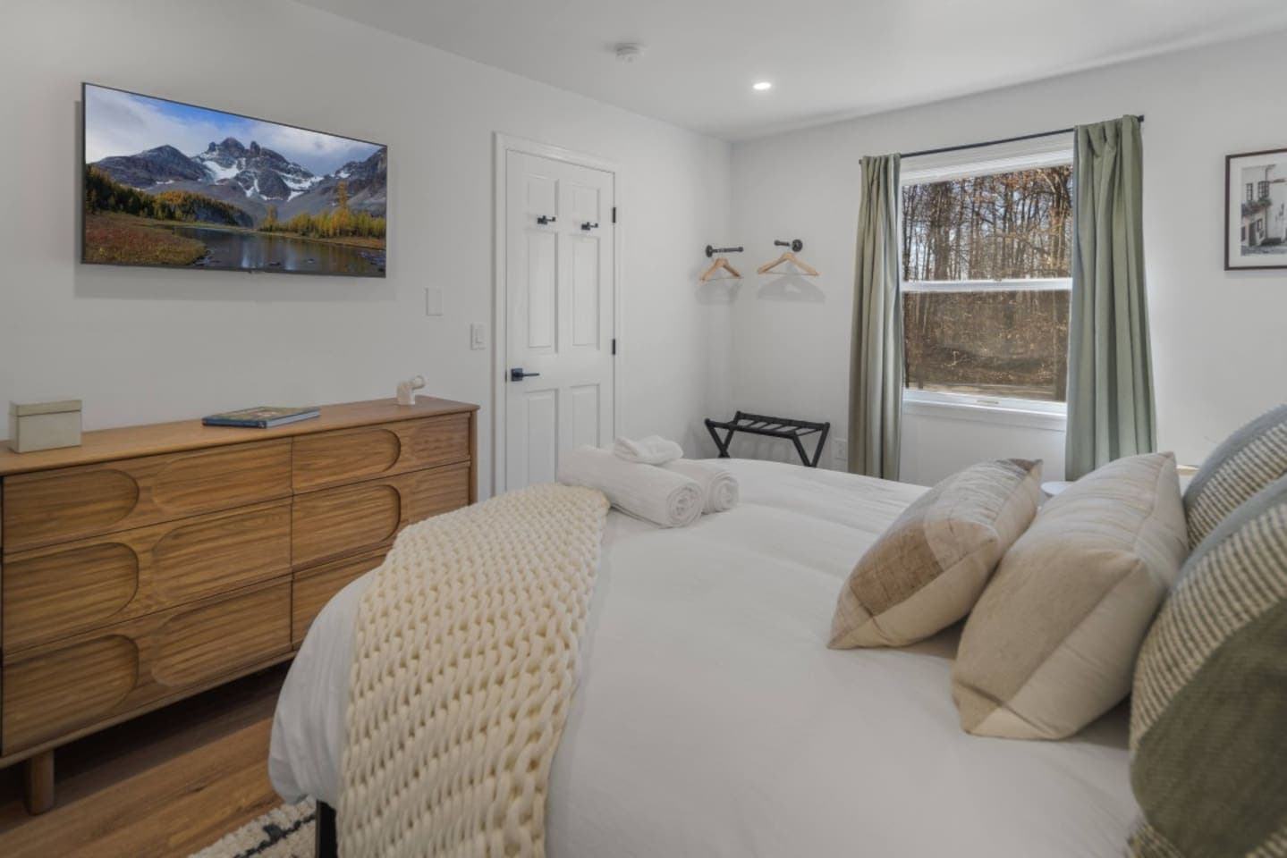 Bedroom with dresser and natural light