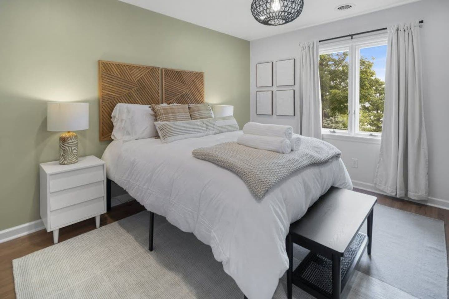 Bedroom with woven headboard and natural light