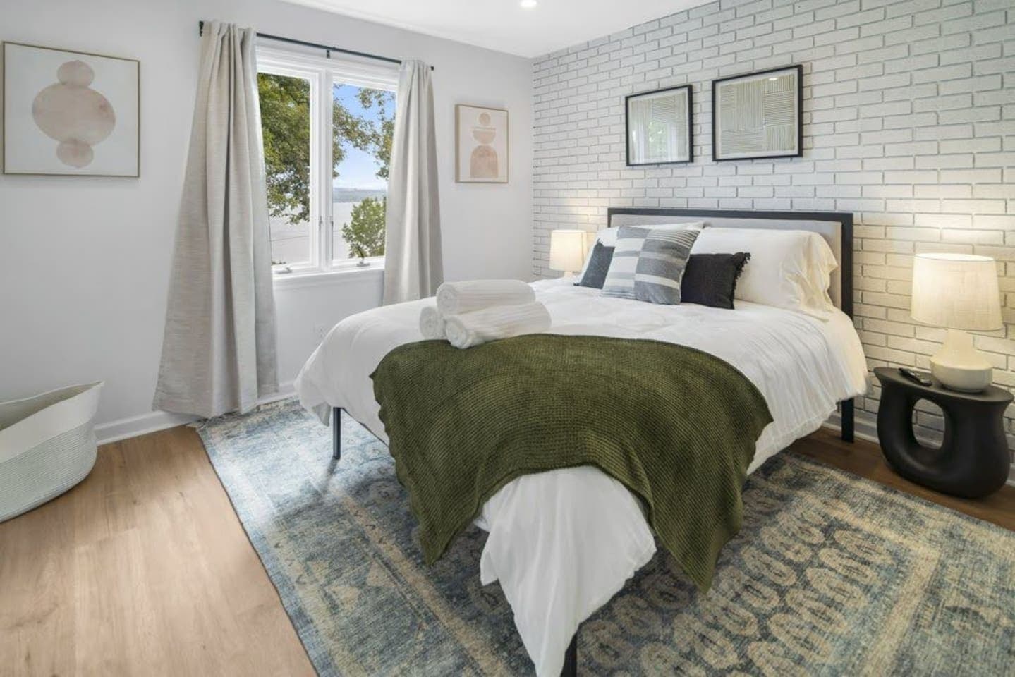 Bedroom with white brick accent wall