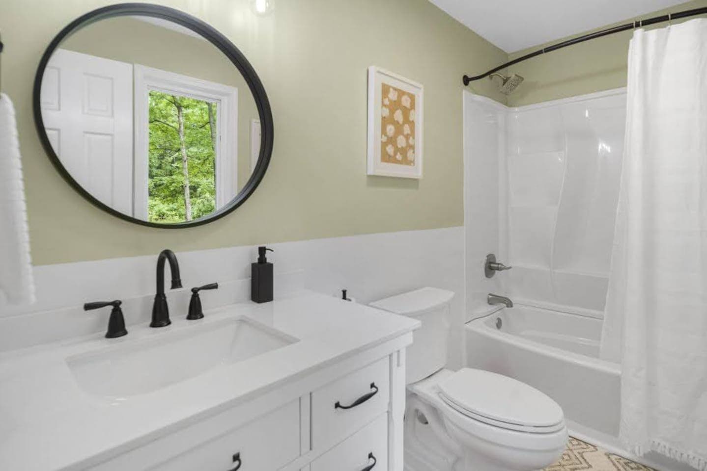 Bathroom with tub and double vanity