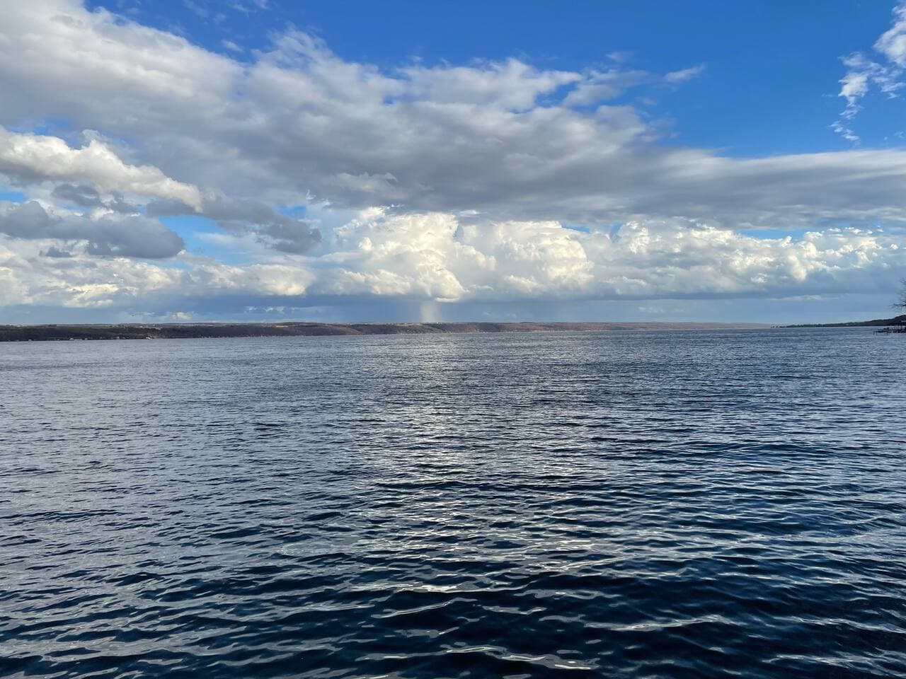 Open water view beneath cloudy skies