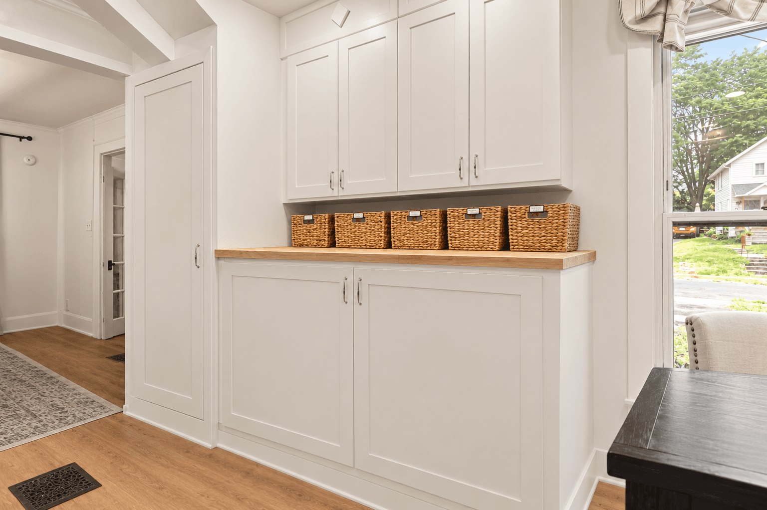 Washer and dryer beneath open shelving
