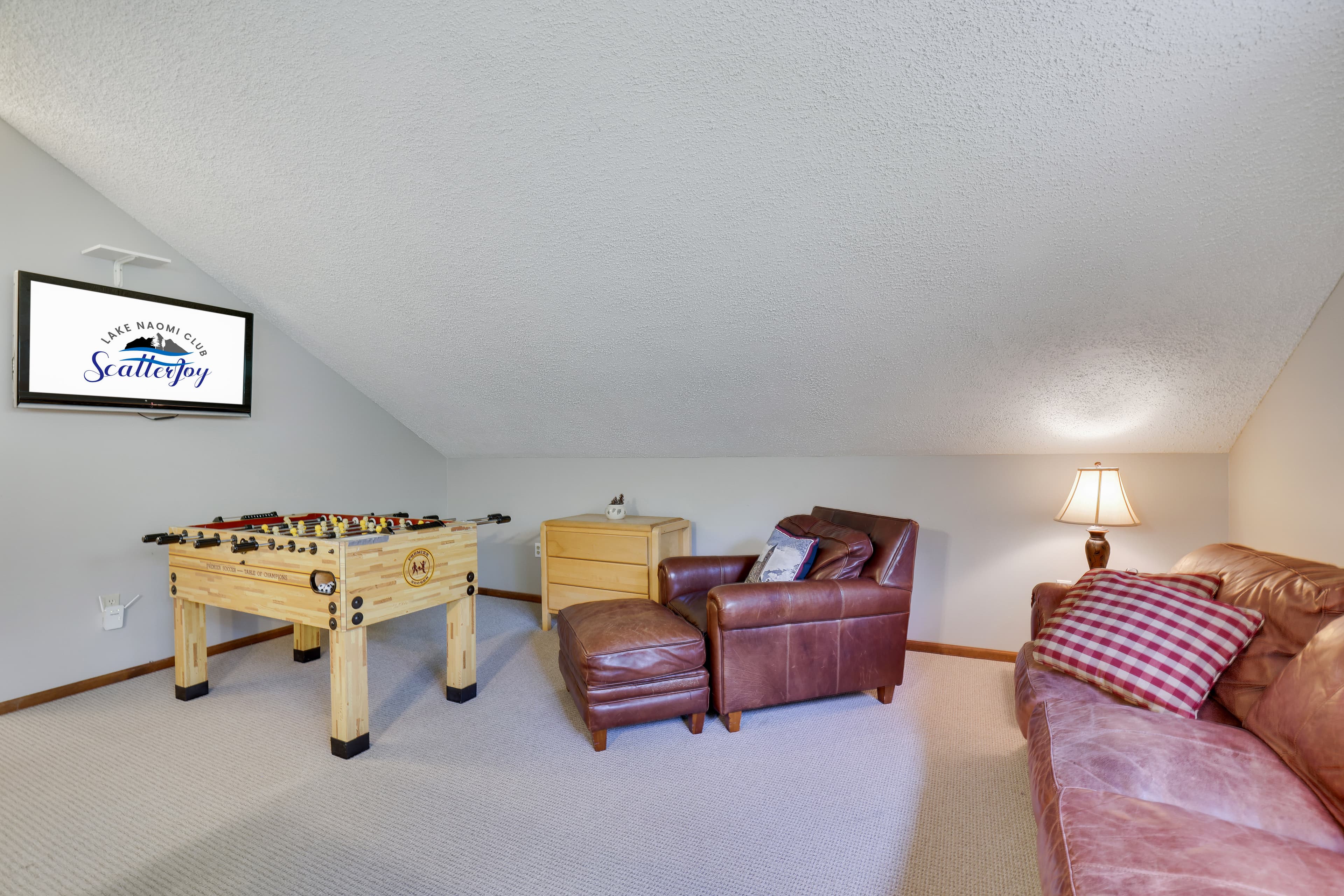 Foosball and TV in game room