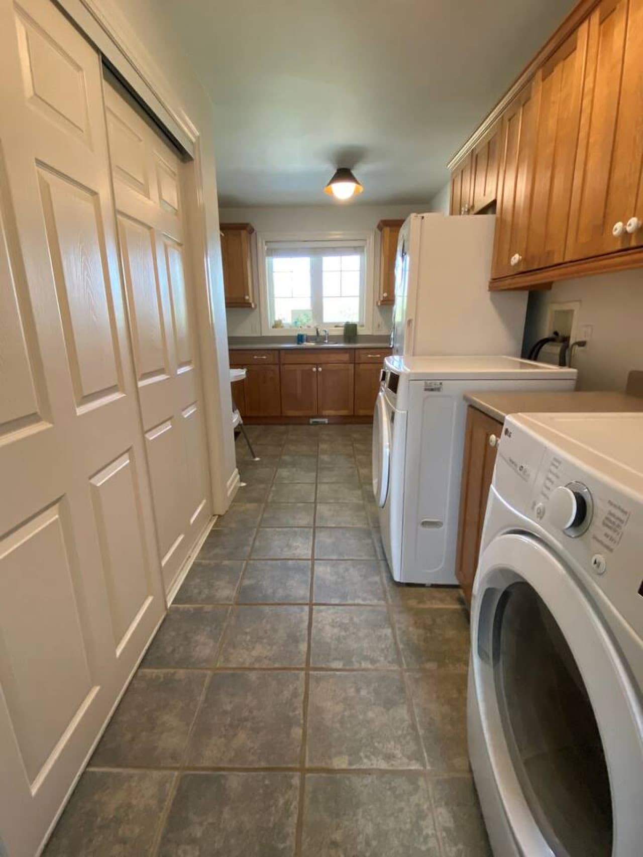 Main level laundry area is accessible to guests. Here you'll also find lots of storage, a second fridge, and a wet bar
