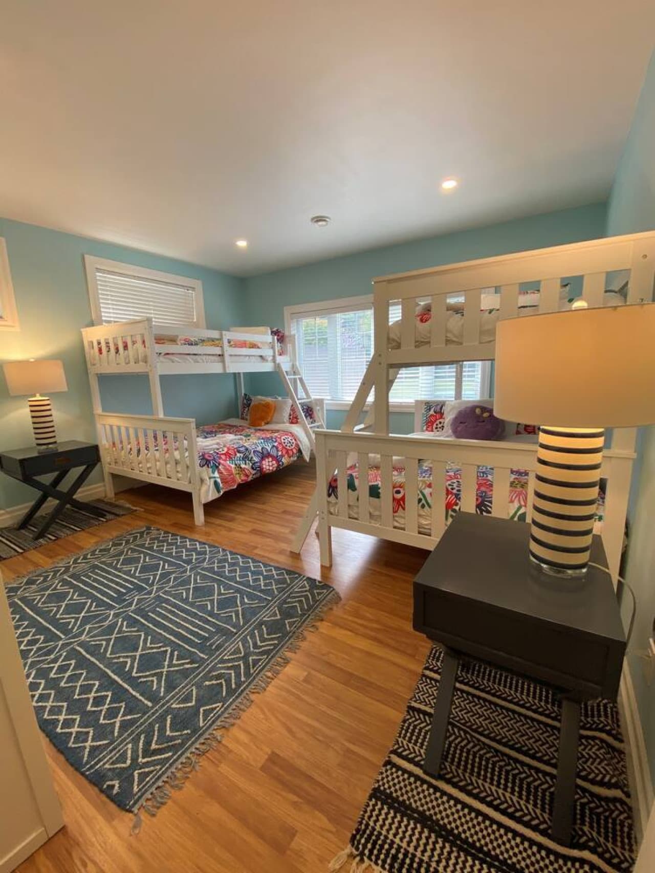 Lower Level. Bedroom #4 with two single-over-double bunk bed sets. Closet, wardrobe, and lots of windows.