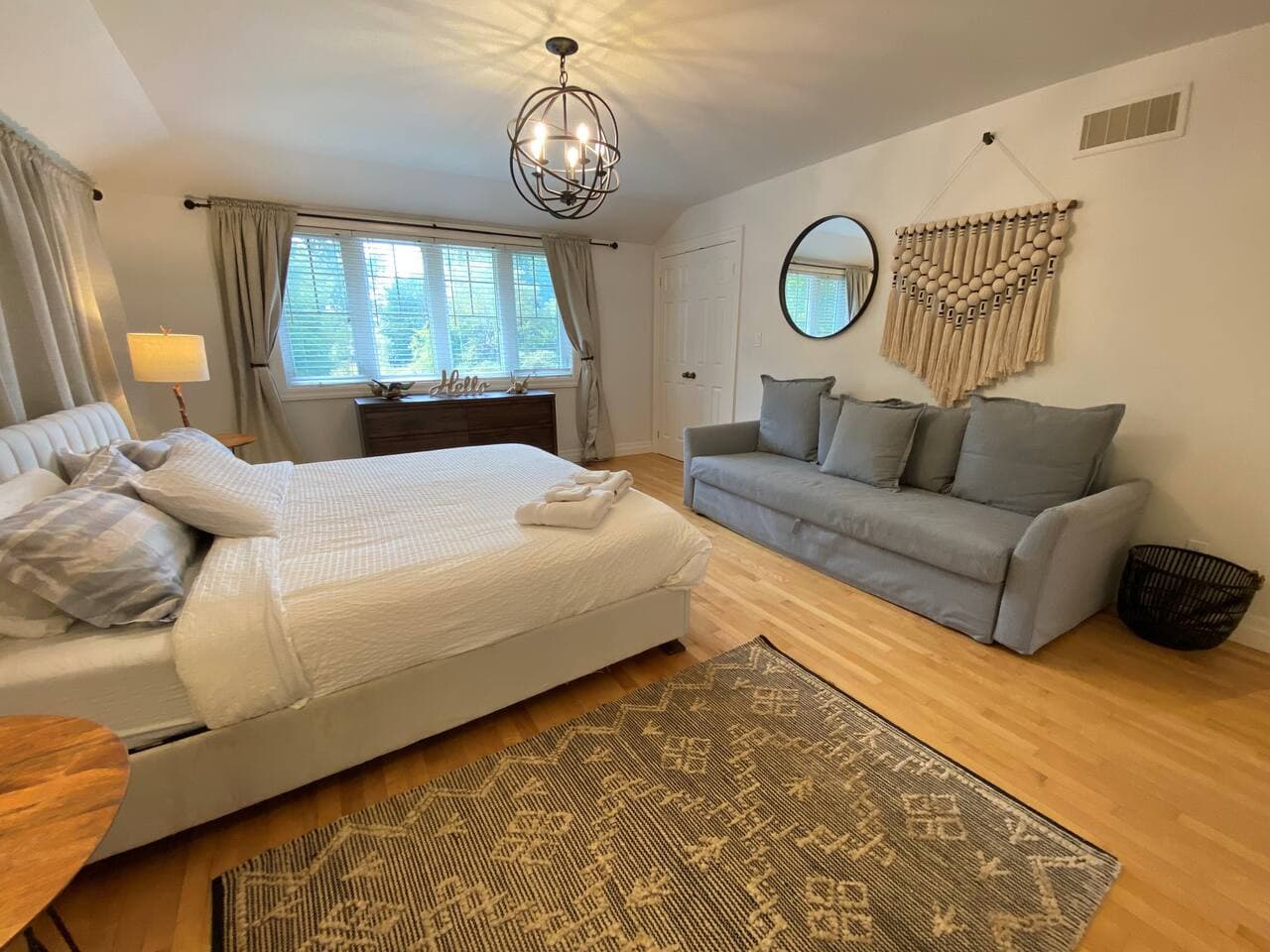 Master Bedroom Suite with attached ensuite bathroom. King-sized bed and a sofa! All bed and bath linens are provided. Main Level.
