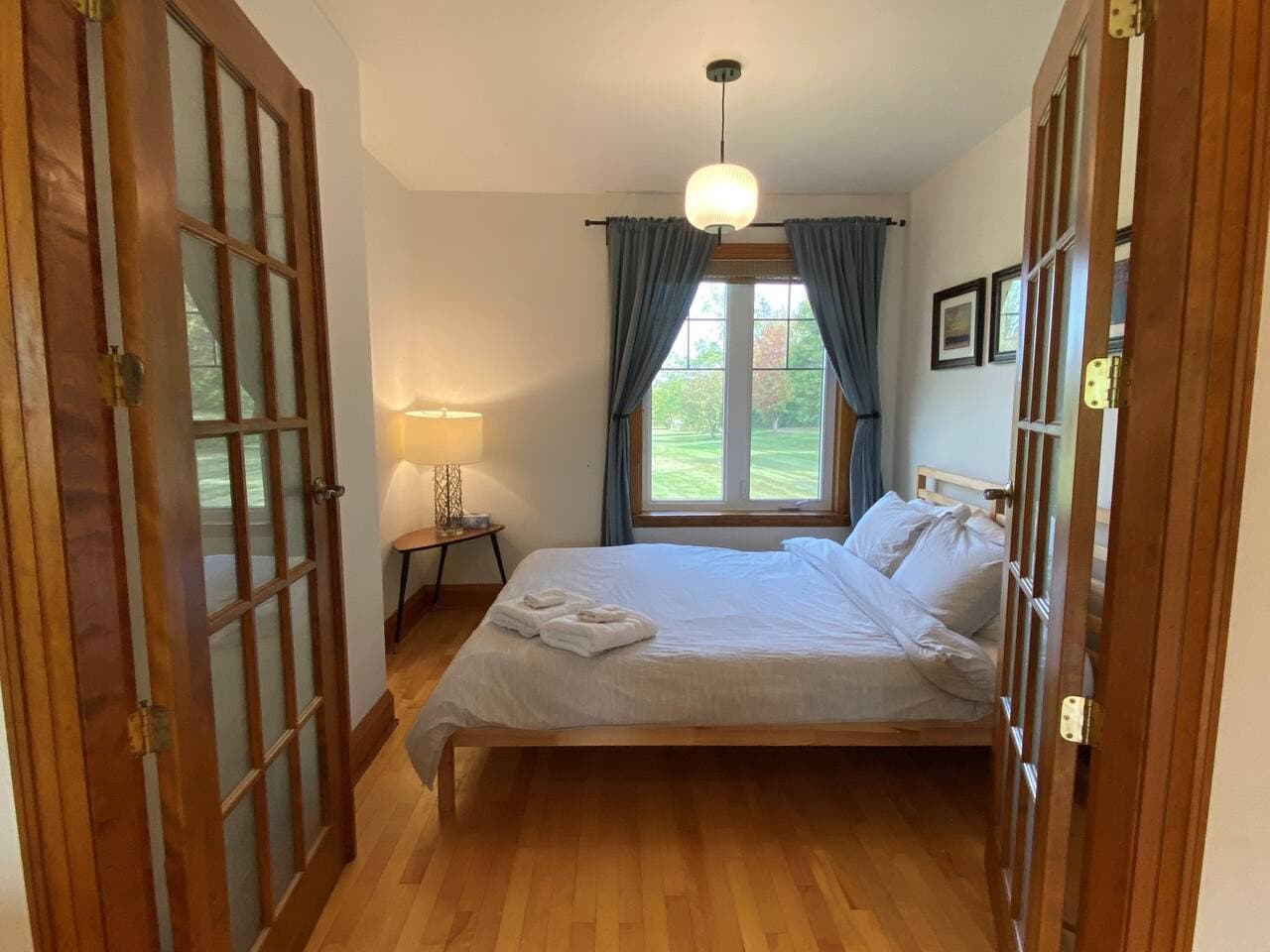 Bedroom #2 with queen bed, closet. Main level next to the living room. French doors!