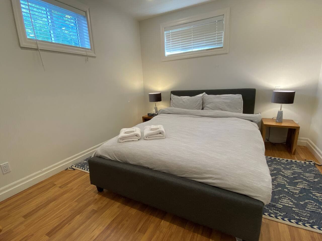 Lower level. Bedroom #3 with queen bed and small chair