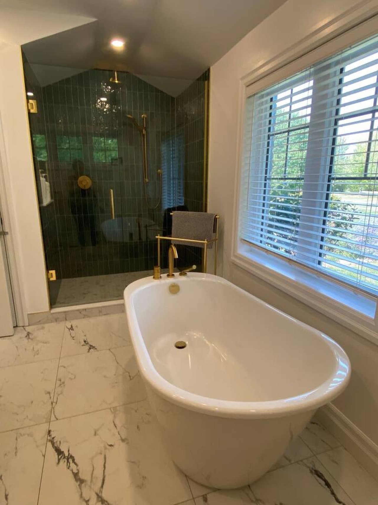 Ensuite bathroom off of the master bedroom. Double vanity, large walk-in shower and deep soaker tub. Main Level.