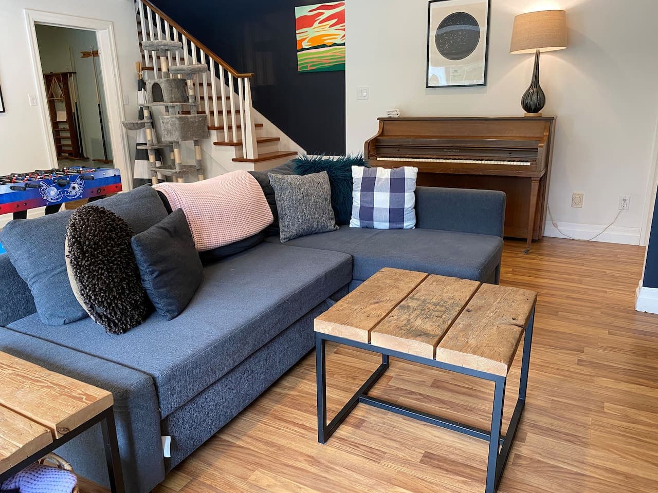 Rec room in lower level/media room. Foosball table, gaming, huge smart TV, wood fireplace, board games, kids toy area. Walkout to the back patio where you'll find a ping pong table and more seating