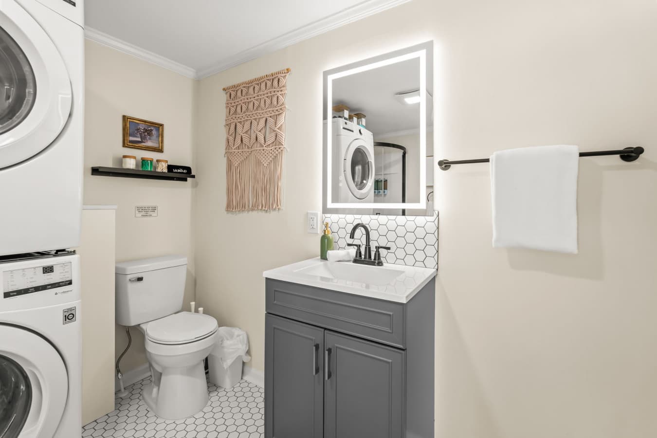 Fresh bathroom w/ modern vanity, bright lighting, & a clean, simple setup for daily routines.