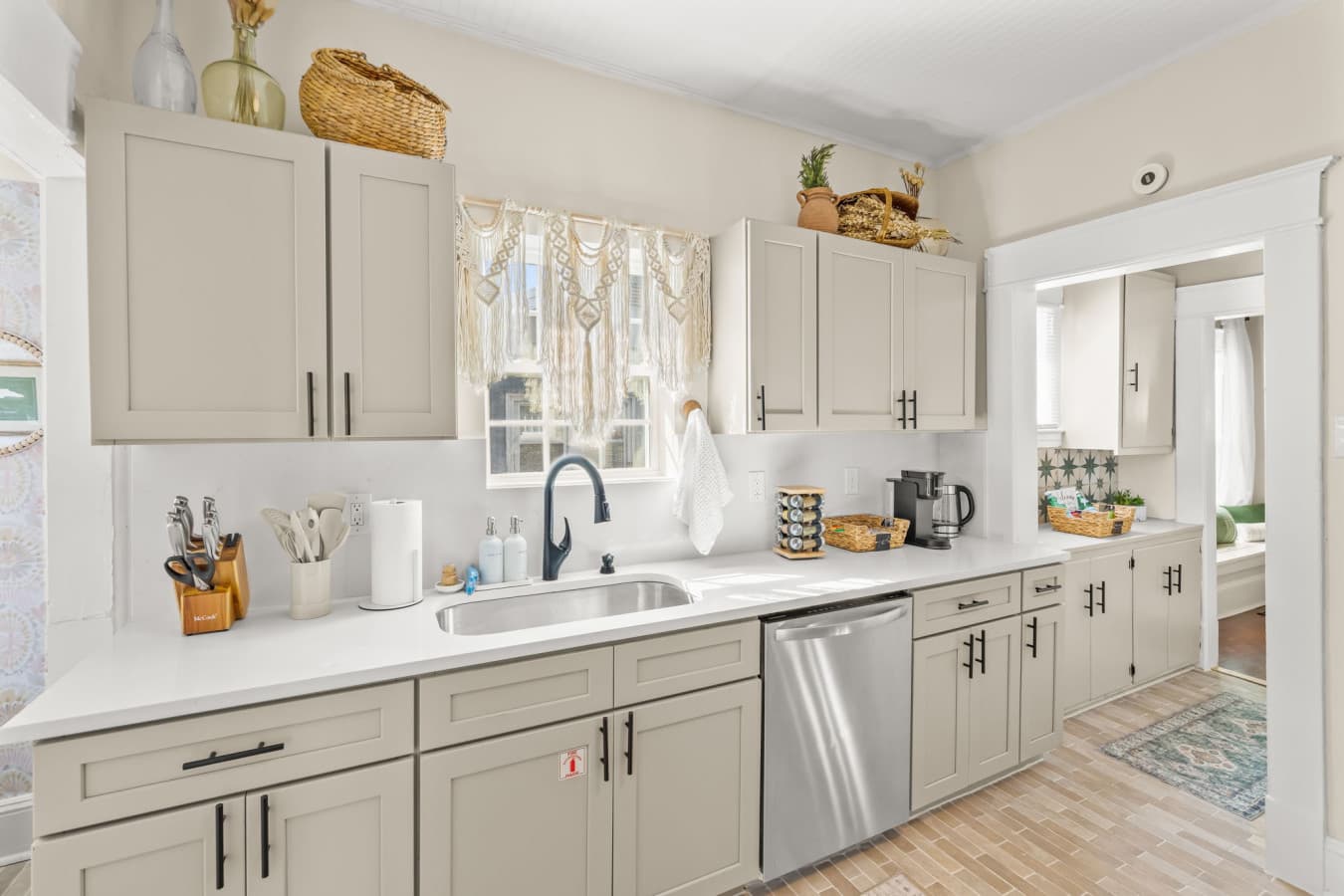 Spacious kitchen view w/ generous counters, updated appliances, & room to prep meals comfortably.