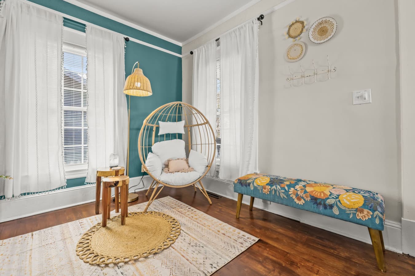 Cozy sitting nook w/ comfy seating, natural light, & a calm spot to read or unwind.
