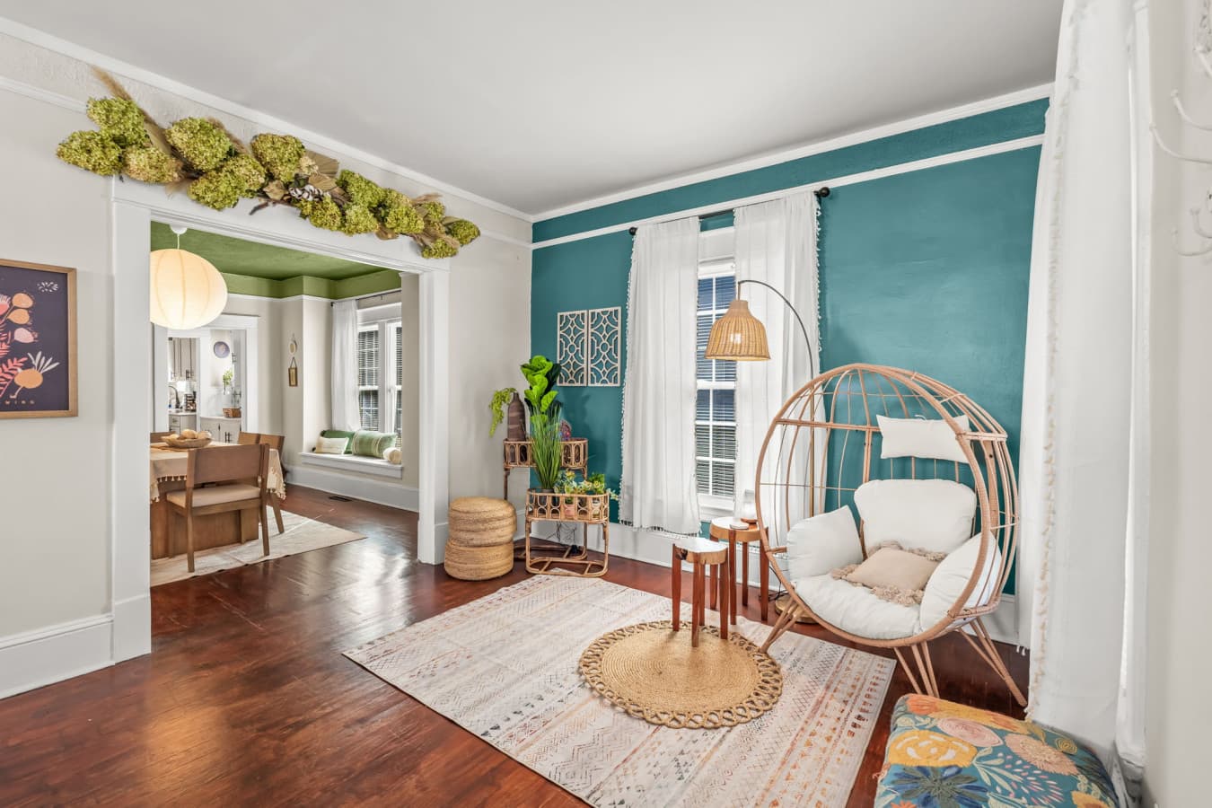 Stylish living area w/ layered textures, playful color accents, & an inviting place to gather.